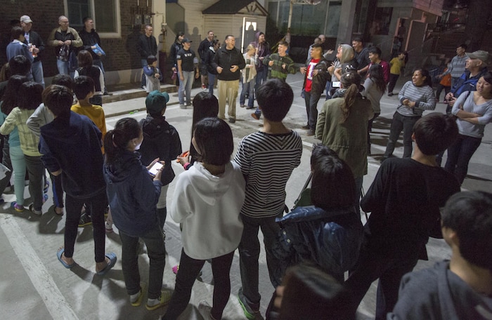 Lt. Travis Coffey, deputy chaplain for Marine Aircraft Group 12, leads service members in the singing of the alphabet to children of an orphanage in Gunsan, Oct. 29, 2013. The community relations project was headed by the Air Force, who invited Marines to join along for the outing. 