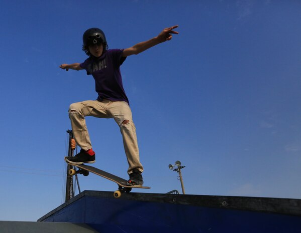 Spencer Boucher, 14, performs a backside crooked grind during a skate competition at XtremeWorks Skate Park aboard Marine Corps Air Station Iwakuni, Japan, Nov. 9, 2013. According to Lance Cpl. Jose Caldera, a data network specialist with Headquarters and Headquarters Squadron and coordinator of the competition, he plans to host the next competition in early spring of 2014.