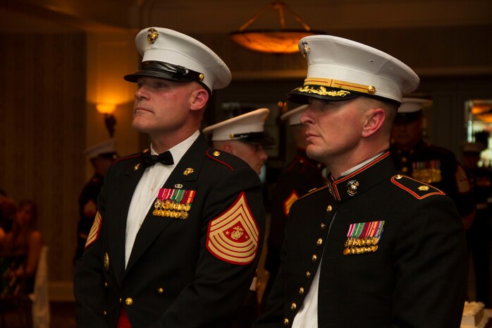 Sgt. Maj. Micheal P. Barrett, 17th Sgt. Maj. of the Marine Corps, and Maj. Charles D. Godwin, Recruiting Station Milwaukee Commanding Officer, view the Commandant’s birthday message during RS Milwaukee’s birthday ball on November 15, 2013.