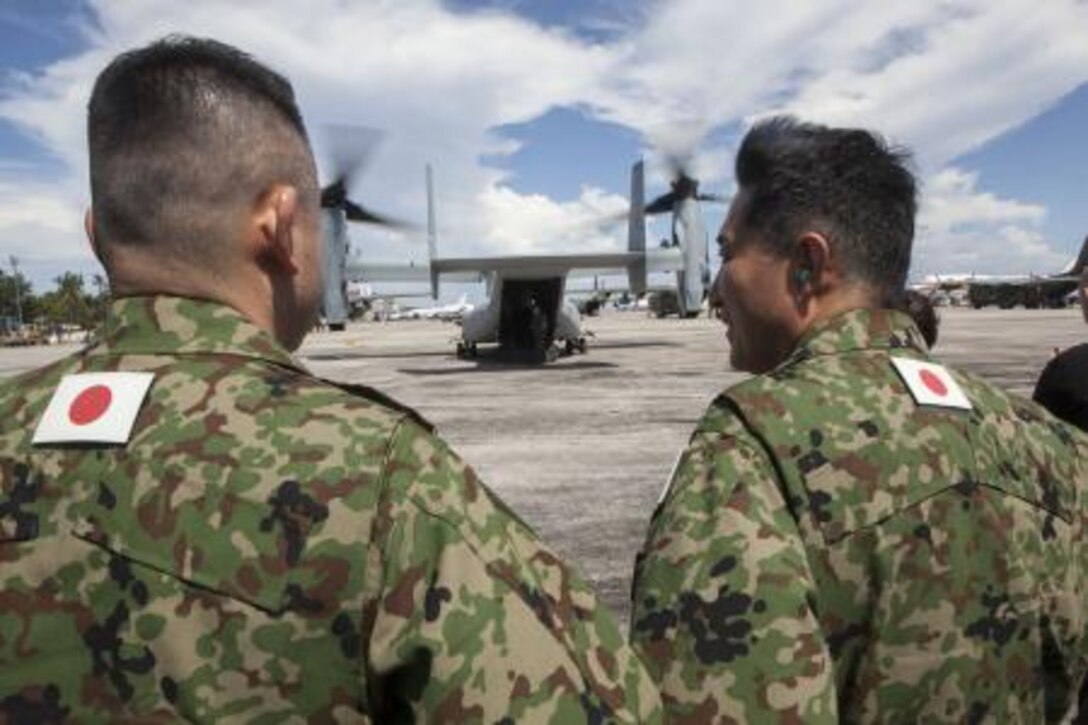 Japan Ground Self-Defense Force members wait to board an MV-22B Osprey aircraft Nov. 14 as part of Operation Damayan. The aircraft, JGSDF members and other relief personnel later landed in Tacloban to provide support to the Philippine government who is spearheading relief efforts in the wake of Typhoon Haiyan.