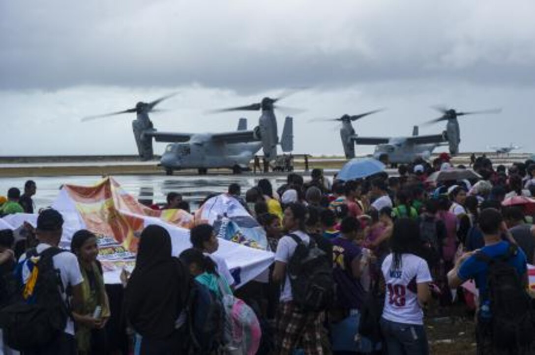 MV-22 Ospreys assigned to the Marine Medium Tiltrotor Squadron 261, 1st Marine Aircraft Wing, take on supplies to provide aid during "Operation Damayan." The George Washington Strike Group supports the 3rd Marine Expeditionary Brigade to assist the Philippine government in response to the aftermath of Super Typhoon Haiyan/Yolanda in the Republic of the Philippines.