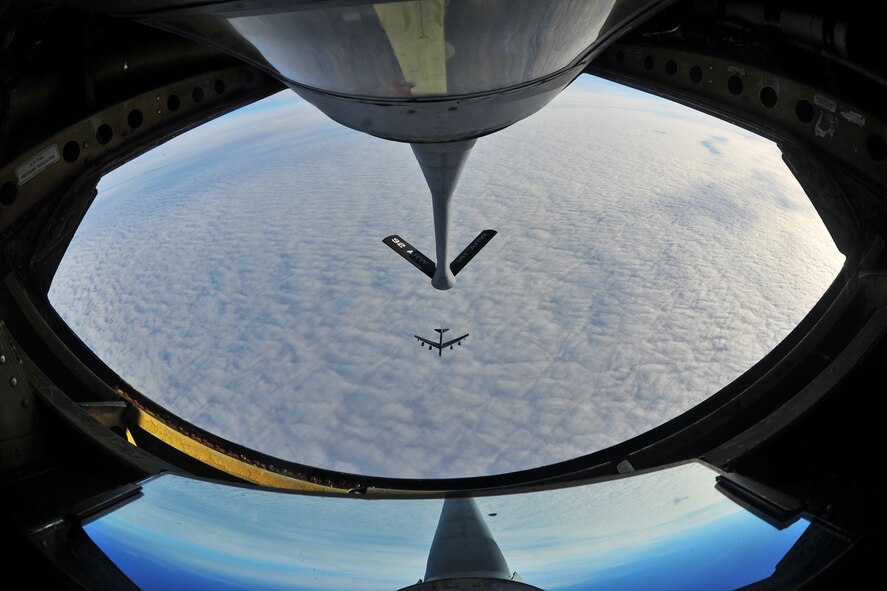 A B-52 Stratofortress flies beneath a KC-135 Stratotanker Nov. 3, 2013. (U.S Air Force photo/Senior Airman Taylor Curry) 


