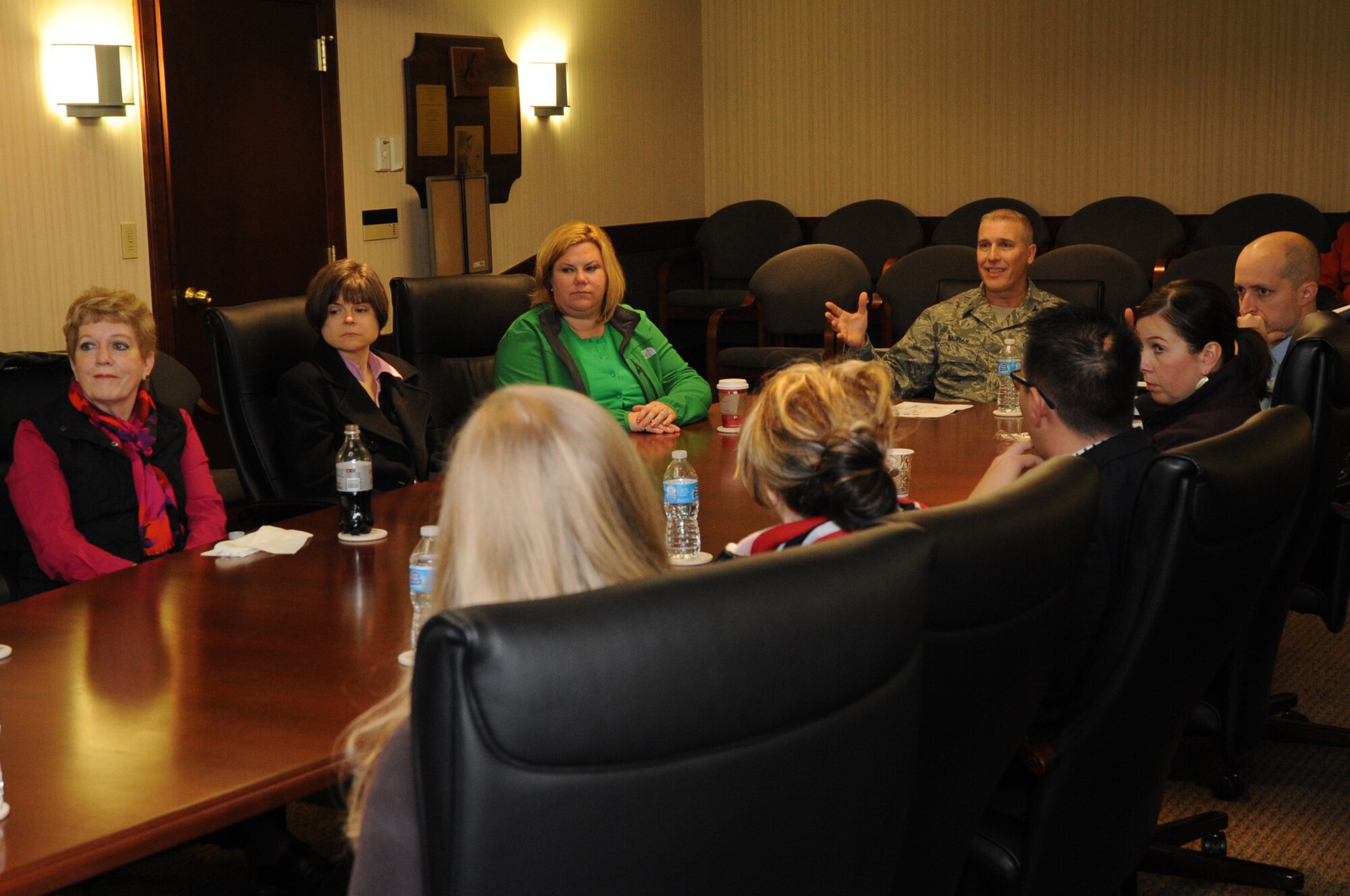 Col. Paul Bauman, 319th Air Base Wing commander, discusses operations on Grand Forks Air Force Base, N.D., with members of North Dakota Senator Heidi Heitkamp's staff, Nov. 16, 2013. The congressional staff members visited the base to learn about its mission and conduct a training session. (U.S. Air Force photo/Staff Sgt. David Dobrydney)