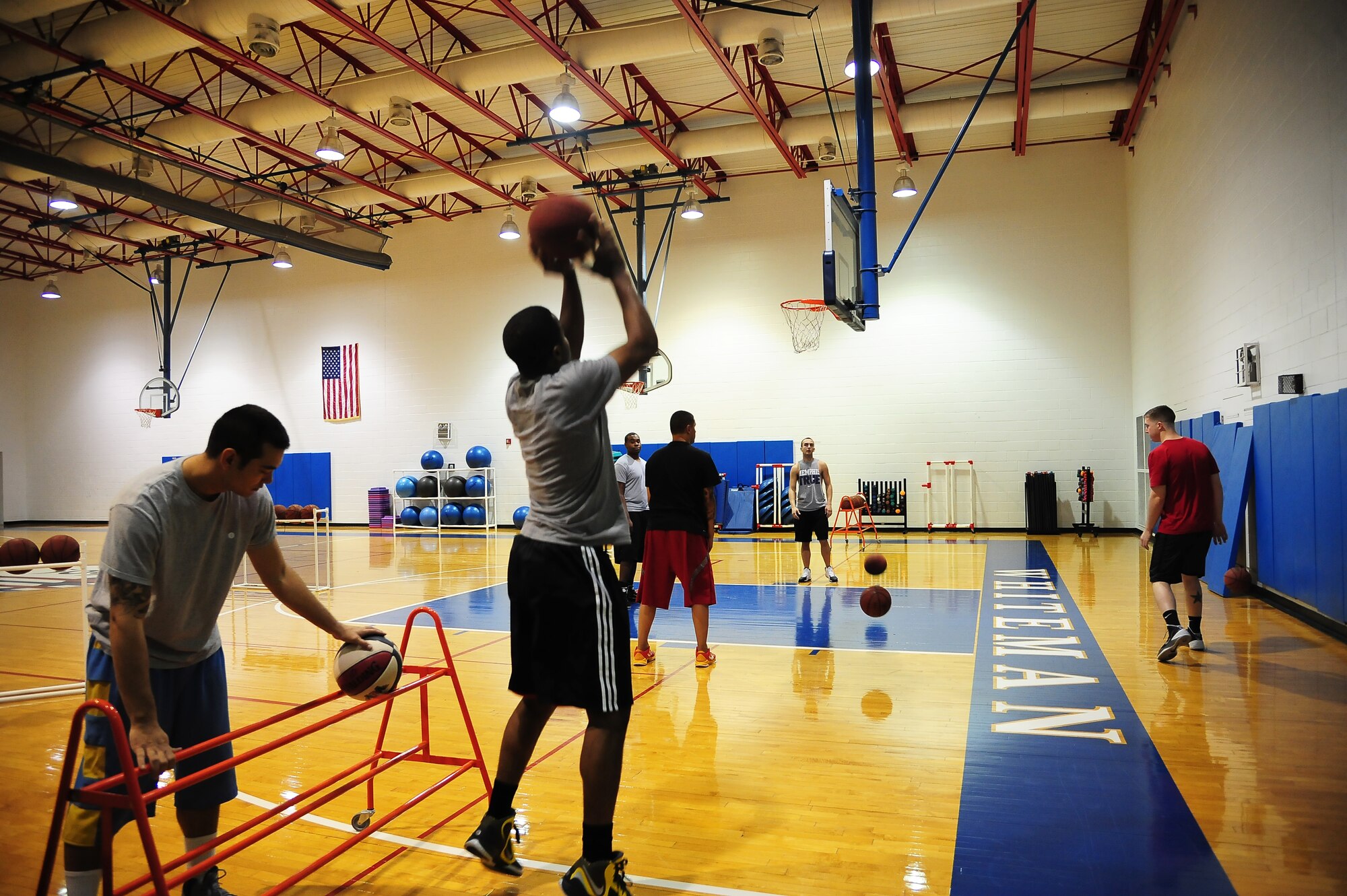Zach Jones from the 509th Maintenance Squadron tries for a basket during the Combined Federal Campaign (CFC) three-point shoot-out Nov. 8, 2013, at Whiteman Air Force Base, Mo. Whiteman’s goal for this year’s campaign is $140,000. (U.S. Air Force photo by Staff Sgt. Brigitte N. Brantley/Released)