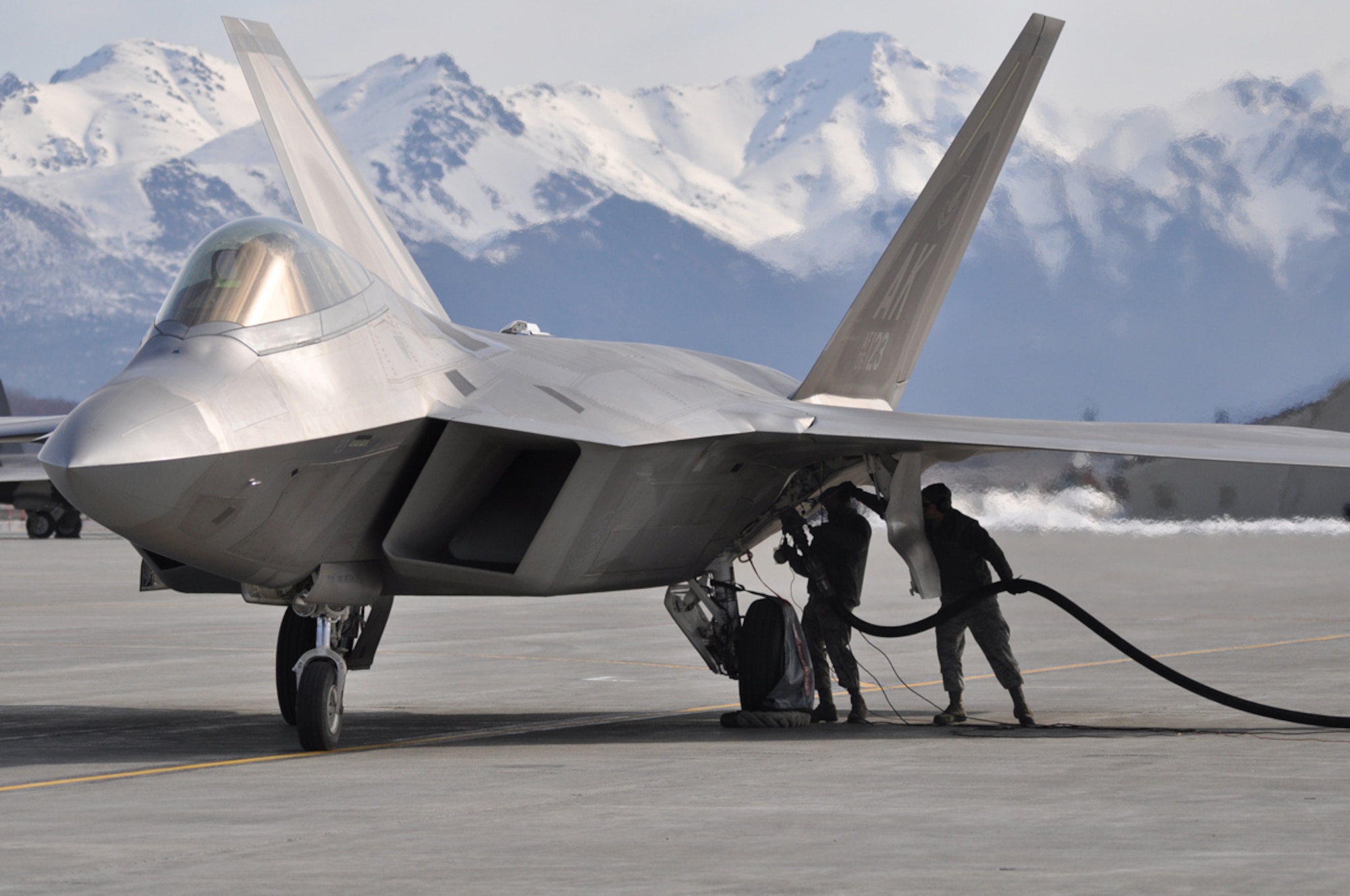 Airmen from the 3rd and 477th Aircraft Maintenance Squadrons perform a hot pit refuel with an F-22 Raptor May 1. (U.S. Air Force photo/Tech. Sgt. Dana Rosso)