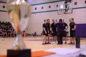 U.S. Army Soldiers huddle together before a dodgeball match at the McClellan Fitness Center at Fort Eustis, Va., Sept. 24, 2013. The Better Opportunities for Single Soldiers organization boasts a three-pillar mission: quality of life, community service and recreation and leisure. (U.S. Air Force photo by Staff Sgt. Ciara Wymbs/Released)