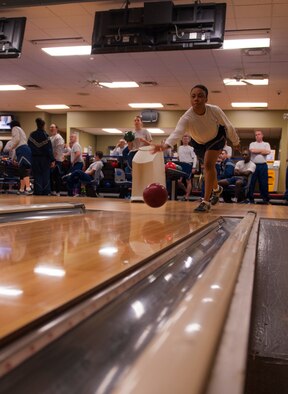 U.S. Air Force Staff Sgt. Shahayla Colson, 347th Operation Support Squadron aircrew flight equipment technician, throws a bowling ball during a Comprehensive Airman Fitness (CAF) Day event at Moody Air Force Base, Ga., Nov. 15, 2013. Combat bowling fell under the physical pillar of the four-pillar CAF program. (U.S. Air Force photo by Airman 1st Class Alexis Grotz/Released)