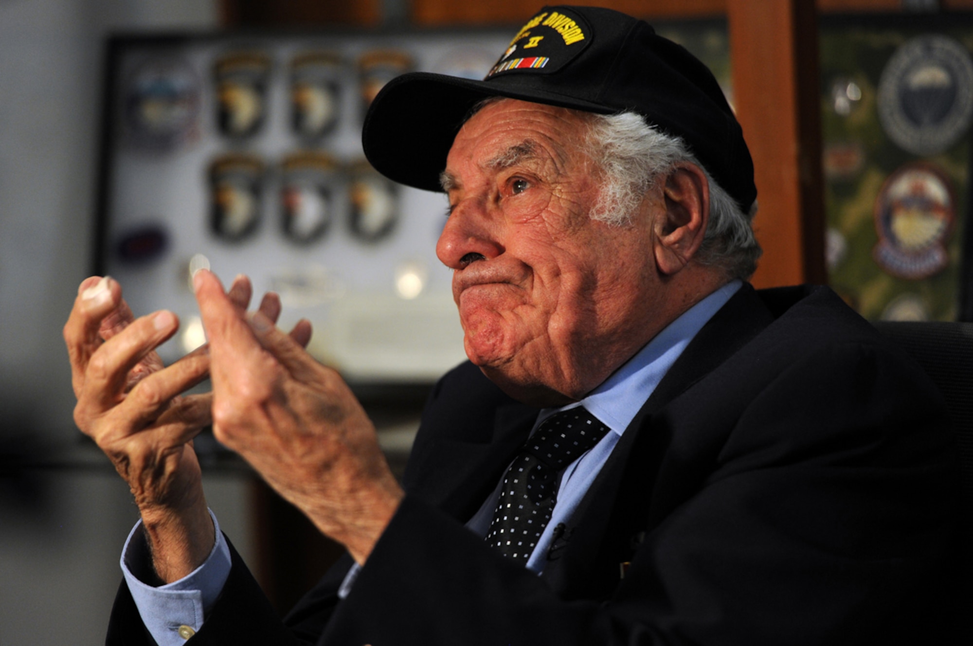 World War II veteran Vincent Speranza, 88, from Auburn Ill., is overcome with emotion and his eyes well with tears as he pauses while recounting his experiences fighting in the siege of Bastogne during the Battle of the Bulge while visiting with Soldiers of the 1st Battalion (Airborne), 501st Infantry Regiment, part of U.S. Army Alaska's 4th Infantry Brigade Combat Team (Airborne), 25th Infantry Division, at Joint Base Elmendorf-Richardson, Alaska, Nov. 6. Speranza, a combat veteran of H Company, 501st Parachute Infantry Regiment, then part of the 101st Airborne Division, fought at Bastogne, was wounded in combat shortly after the Battle of the Bulge, and when the 101st Airborne deactivated after the war was transferred to the 82nd Airborne for a brief period. (U.S. Air Force photo by Justin Connaher/Released)