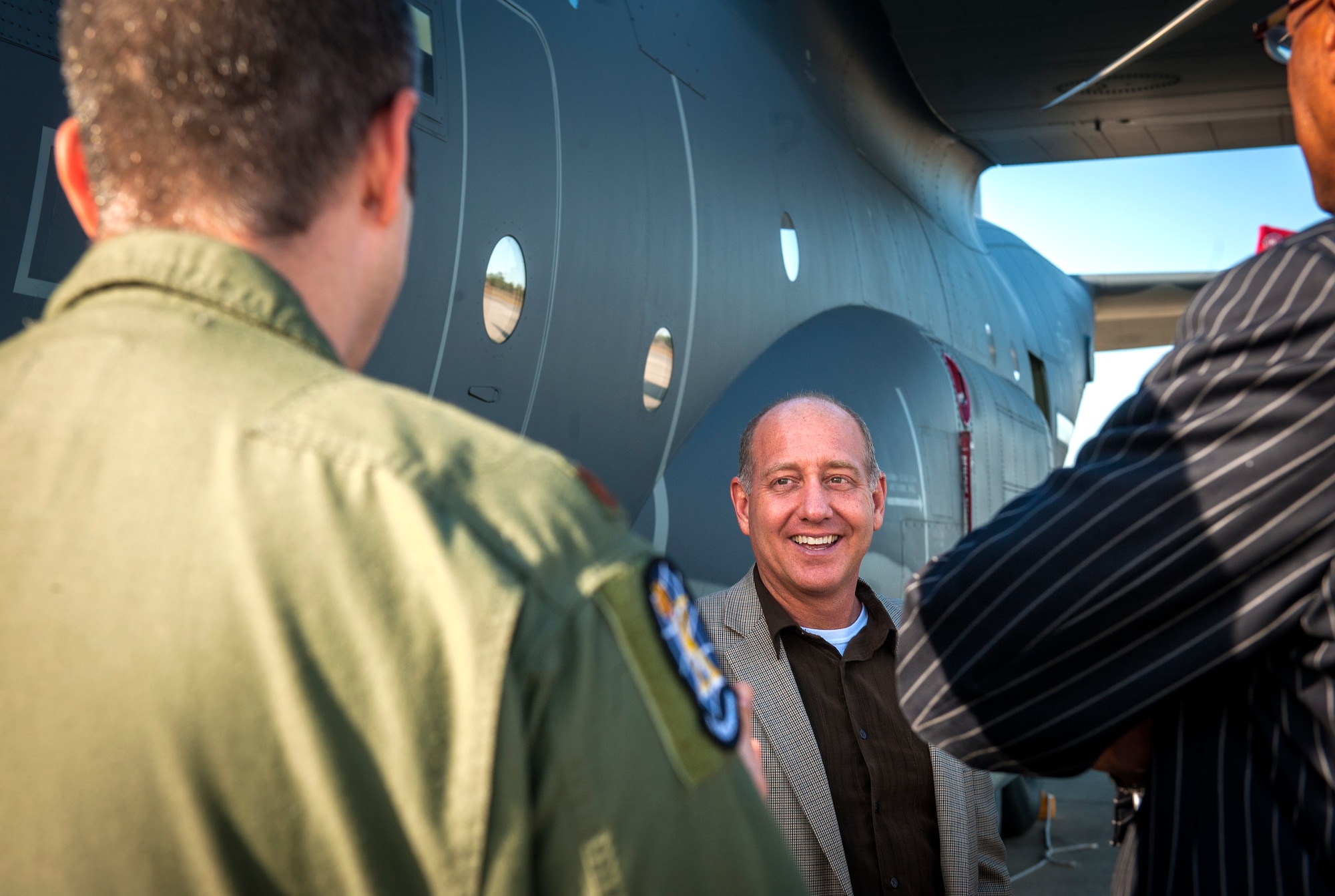 The Rev. Jeff Williams, New Covenant Church associate pastor, talks to an HC-130J Combat King II pilot during the Partners for Spiritual Fitness for Moody Warriors visit at Moody Air Force Base, Ga., Nov. 14, 2013. During the visit, local clergy members met with Moody chaplains to discuss partnership ideas and foster working relationships with local churches. (U.S. Air Force photo by Senior Airman Jarrod Grammel/Released)
