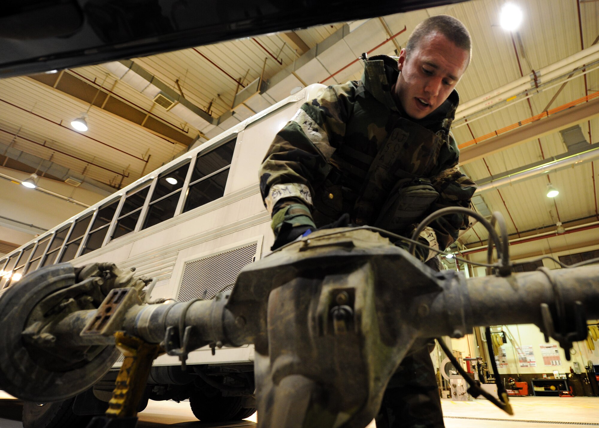 Senior Airman Joshua Ghiloni, 51st Logistics Readiness Squadron vehicle maintenance technician, services the axle of a large truck during Operational Readiness Exercise Beverly Bulldog 14-01 at Osan Air Base, Republic of Korea, Nov. 19, 2013. The 134 personnel assigned to the VM unit maintain the Pacific Air Forces’ second largest vehicle fleet of almost 1,500 vehicles. (U.S. Air Force photo/Staff Sgt. Sara Csurilla)