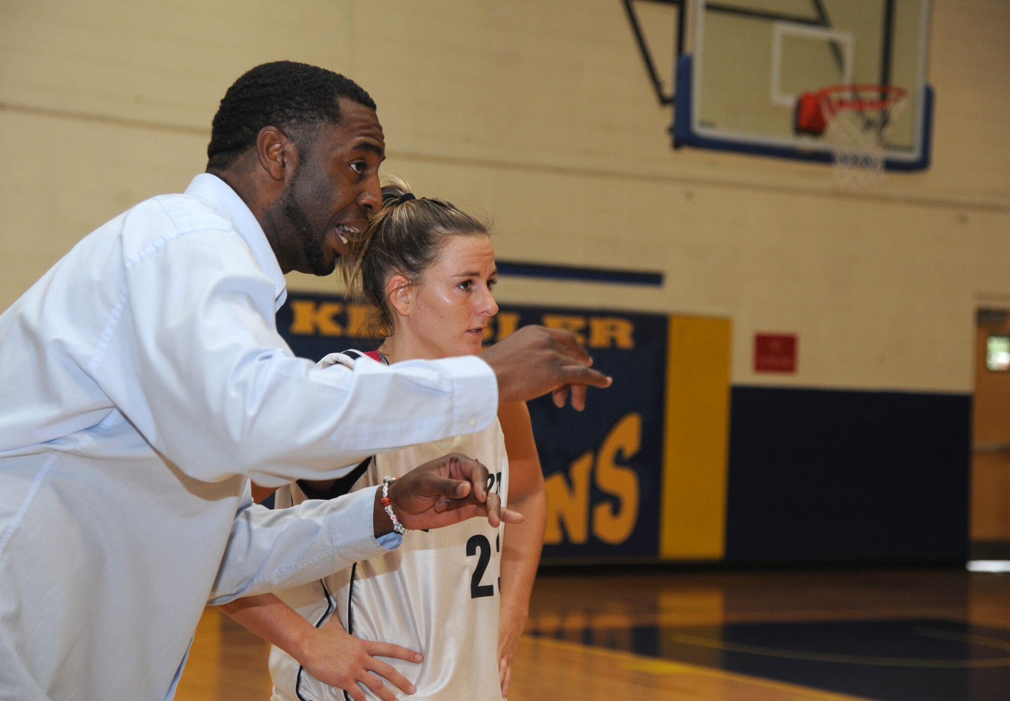 Jason Washington, Keesler head coach, speaks to one of his players during a women’s varsity basketball game Nov. 16, 2013, Keesler Air Force Base, Miss.  Maxwell-Gunter defeated Keesler 70-60.  (U.S. Air Force photo by Kemberly Groue)