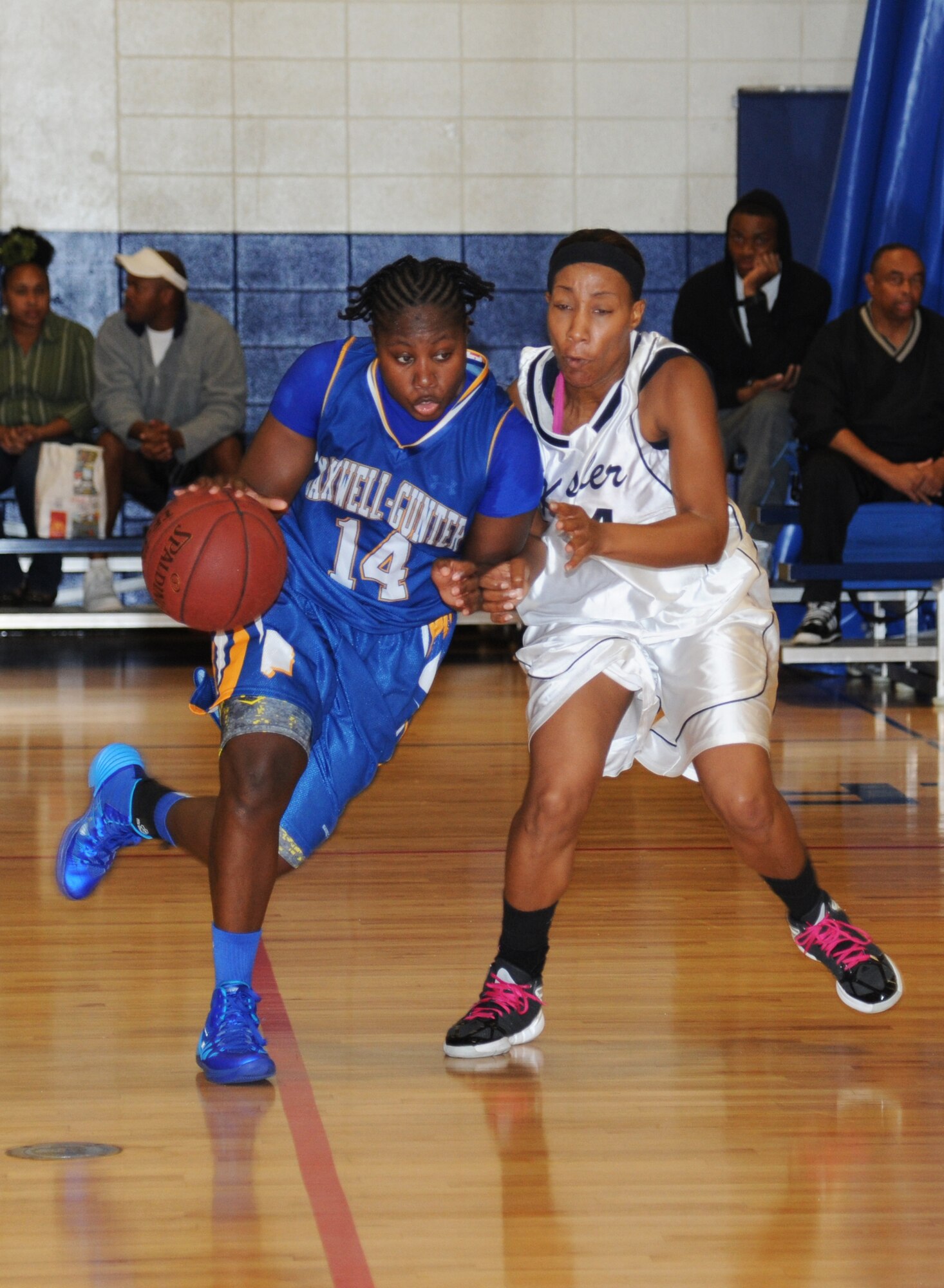 Tasheta Chisolm, Maxwell-Gunter, drives the ball down the court as Tomeika Frazier, Keesler, plays defense during a women’s varsity basketball game Nov. 16, 2013, Keesler Air Force Base, Miss.  Maxwell-Gunter defeated Keesler 70-60.  (U.S. Air Force photo by Kemberly Groue)
