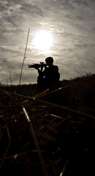 Airman 1st Class Jordan Busche, 791st Missile Security Forces squadron convoy response force member responds to hostile forces during a recapture, recovery exercise, Nov. 14, 2013. The purpose of this training is to maintain readiness for launch facility recapture. (U.S. Air Force photo/Senior Airman Brittany Y. Auld)