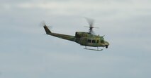 A UH-1N Huey from the 54th Helicopter Squadron flies over the exercise site during 91st Security Forces Group recapture, recovery training Nov. 14, 2013. The exercise is used as a training tool to evaluate the responding forces, their reaction of denying access to the resource from hostile actions, and recovery of the resource if access is gained. (U.S. Air Force photo/Senior Airman Brittany Y. Auld)