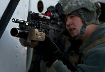 Airman 1st Class Michael Tyler, 791st Missile Security Force Squadron convoy response force member responds to opposing forces during a recapture, recovery exercise, Nov. 14, 2013. The purpose of this training is to maintain readiness for launch facility recapture. (U.S. Air Force photo/Senior Airman Brittany Y. Auld)