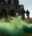 Members of the 791st Missile Security Force Squadron convoy response force rush out of their Bearcats during a recapture, recovery exercise, Nov. 14, 2013. The exercise is used as a training tool to evaluate the responding forces, their reaction of denying access to the resource from hostile actions, and recovery of the resource if access is gained. (U.S. Air Force photo/Senior Airman Brittany Y. Auld)