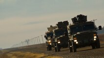 Members of the 91st Security Forces Group convoy and tactical response force respond to hostile actions and secured the resource during a recapture, recovery exercise, Nov. 14, 2013. The purpose of this training is to maintain readiness for launch facility recapture. (U.S. Air Force photo/Senior Airman Brittany Y. Auld)