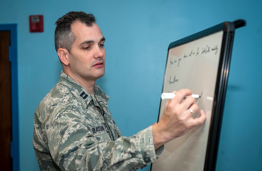 U.S. Air Force Chaplain (Capt.) Jeremiah Blackburn, a chaplain for the 23d Wing Chapel, tracks input from local clergy during the Partners for Spiritual Fitness for Moody Warriors visit at Moody Air Force Base, Ga., Nov. 14, 2013. During the discussion, Moody Chapel staff and local clergy discussed partnership ideas to help better care for Moody Airmen and families. (U.S. Air Force photo by Senior Airman Jarrod Grammel/Released)
