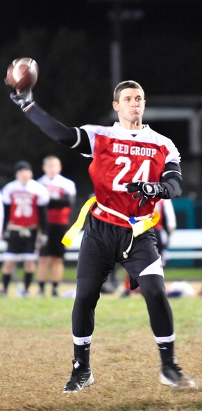 Jason Melanson, 436th Medical Group quarterback, throws a pass during a flag football game against the 9th Airlift Squadron Nov. 14, 2013, at Dover Air Force Base, Del. The 9th AS defeated the 436th MDG 32-12. (U.S. Air Force photo/Airman 1st Class William Johnson) 