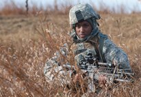 Senior Airman Shanta Edwards, 791st Missile Security Forces Squadron convoy response force member, guards the perimeter of a recaptured payload transporter vehicle during an exercise, Nov. 14, 2013. The exercise is used as a training tool to evaluate the responding forces, their reaction of denying access to the resource from hostile actions, and recovery of the resource if access is gained. (U.S. Air Force photo/Airman 1st Class Apryl Hall)