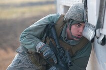 Airman 1st Class Paul Garcia, 791st Missile Security Forces Squadron convoy response force member, searches a payload transporter vehicle for foreign objects during a recapture, recovery exercise, Nov. 14, 2013. The exercise allowed 91st SFG Airmen to practice the necessary procedures that must be made when an asset is compromised. (U.S. Air Force photo/Airman 1st Class Apryl Hall)