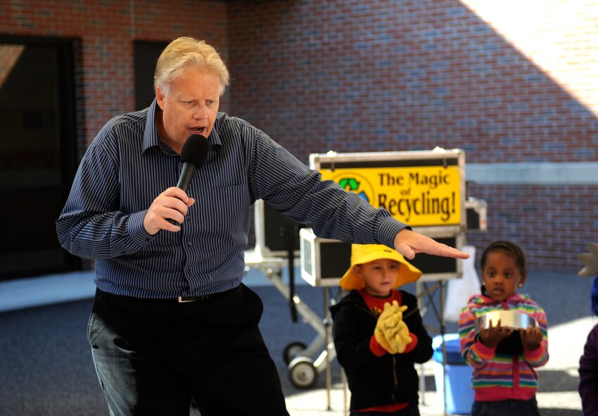 Greg Allen, The Magic of Recycling presenter, uses volunteers to tell a story at the Child Development Center II, Moody Air Force Base, Ga., Nov. 14, 2013. Allen used interactive magic tricks to educate children on the benefits recycling can have on the environment. (U.S. Air Force photo by Senior Airman Olivia Bumpers/Released)