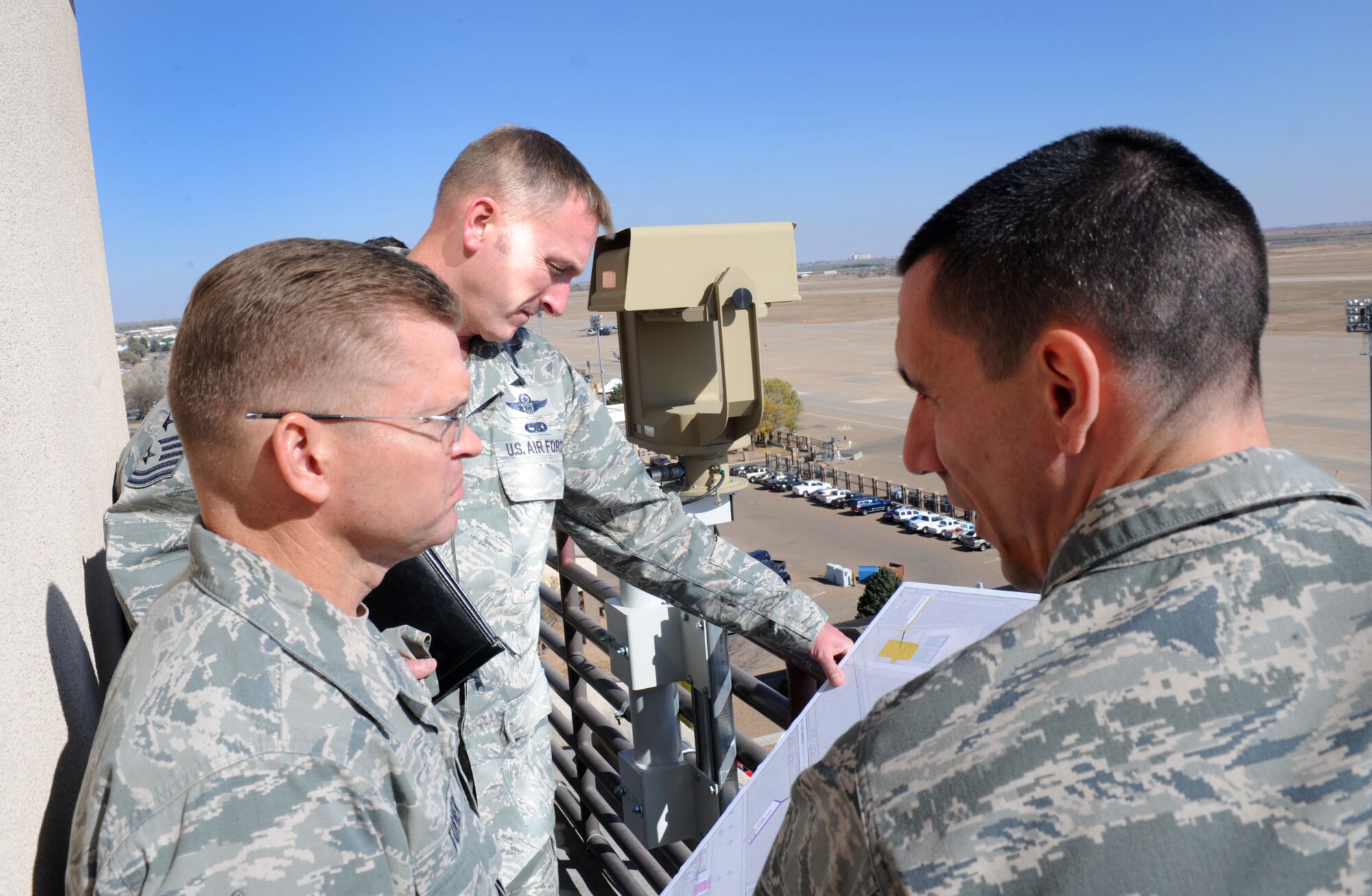 Chief Master Sgt. William Turner, Air Force Special Operations Command command chief, looks over construction plans of new aircraft hangers Nov. 13, 2013, at Cannon Air Force Base, N.M. Turner visited in order to observe Cannon’s progress as a special operations base and interact with Cannon’s Air Commando’s. (U.S. Air Force photo/Senior Airman Ericka Engblom)