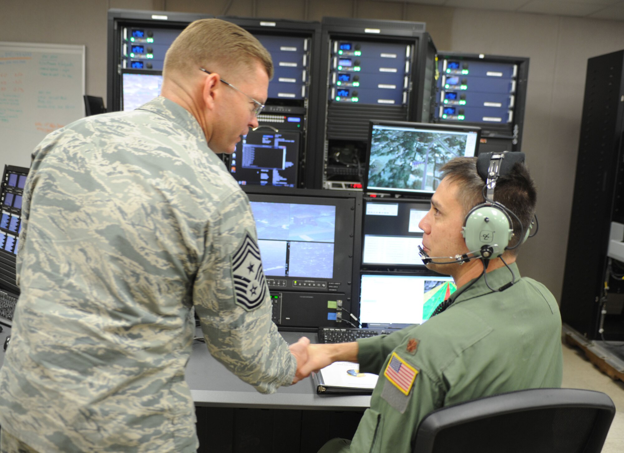 Chief Master Sgt. William Turner, Air Force Special Operations Command command chief, shakes hand with a member of the 551st Special Operation Squadron Nov. 13, 2013, at Cannon Air Force Base, N.M. Turner visited in order to observe Cannon’s progress as a special operations base and interact with Cannon’s Air Commando’s. (U.S. Air Force photo/Senior Airman Ericka Engblom)