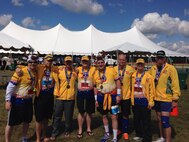 Minot Air Force Base’s 705th Munitions Squadron’s “Team Shockwave” pose for a picture before partcipating in the 17th Annual U.S. Air Force Marathon in Dayton, Ohio, Sept. 21, 2013. In addition to fundraising enough money to make the trip, the team donated $4,823 to The Fisher House, making it the second-largest donation to the foundation during the marathon. (Courtesy photo)