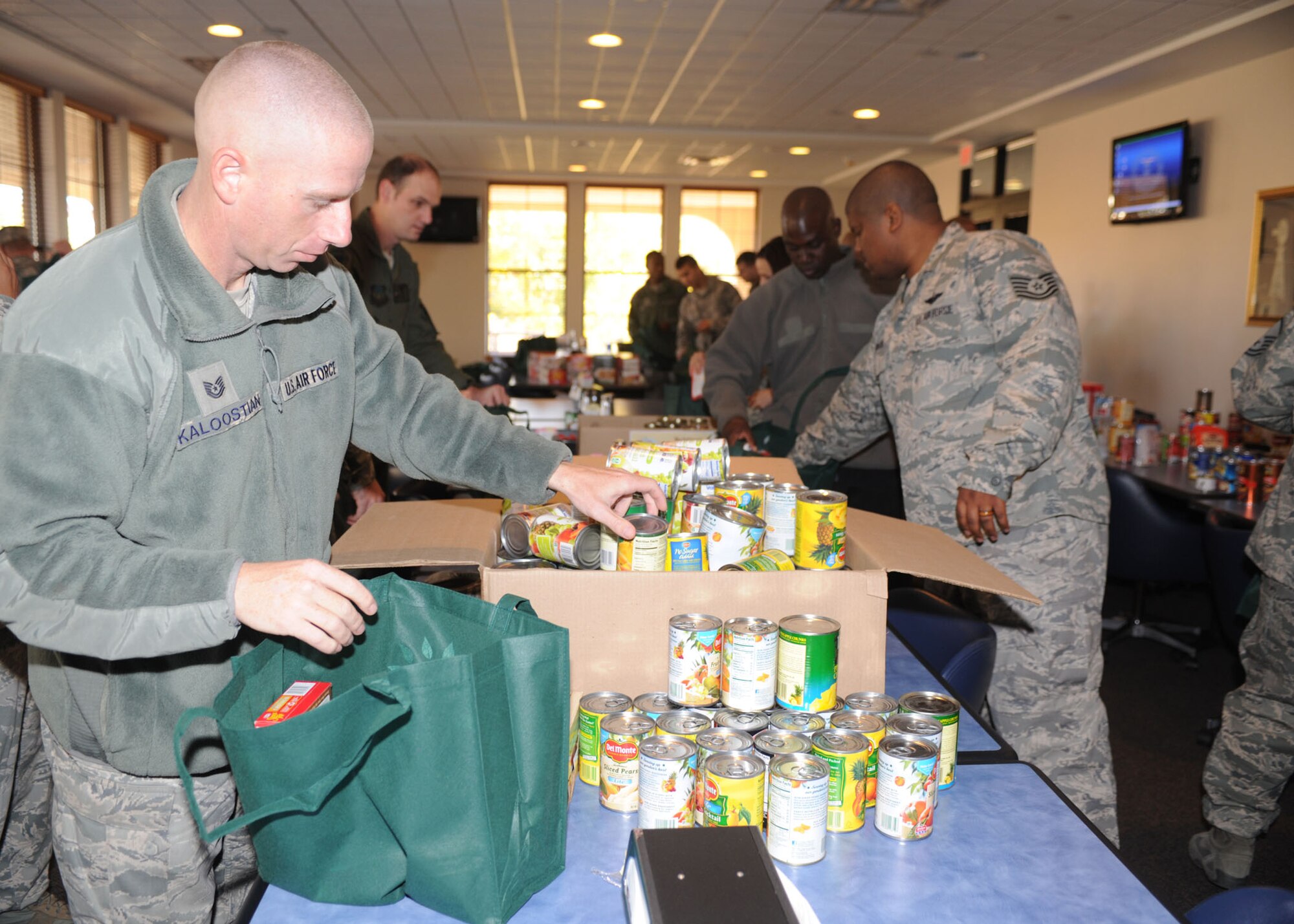 First sergeants create Thanksgiving baskets at the Pecos Trail Dining Facility Nov. 13, 2013, at Cannon Air Force Base, N.M. More than 300 baskets were constructed and will be distributed by the first sergeants to Airmen in need this Thanksgiving season. (U.S. Air Force photo/Senior Airman Ericka Engblom)