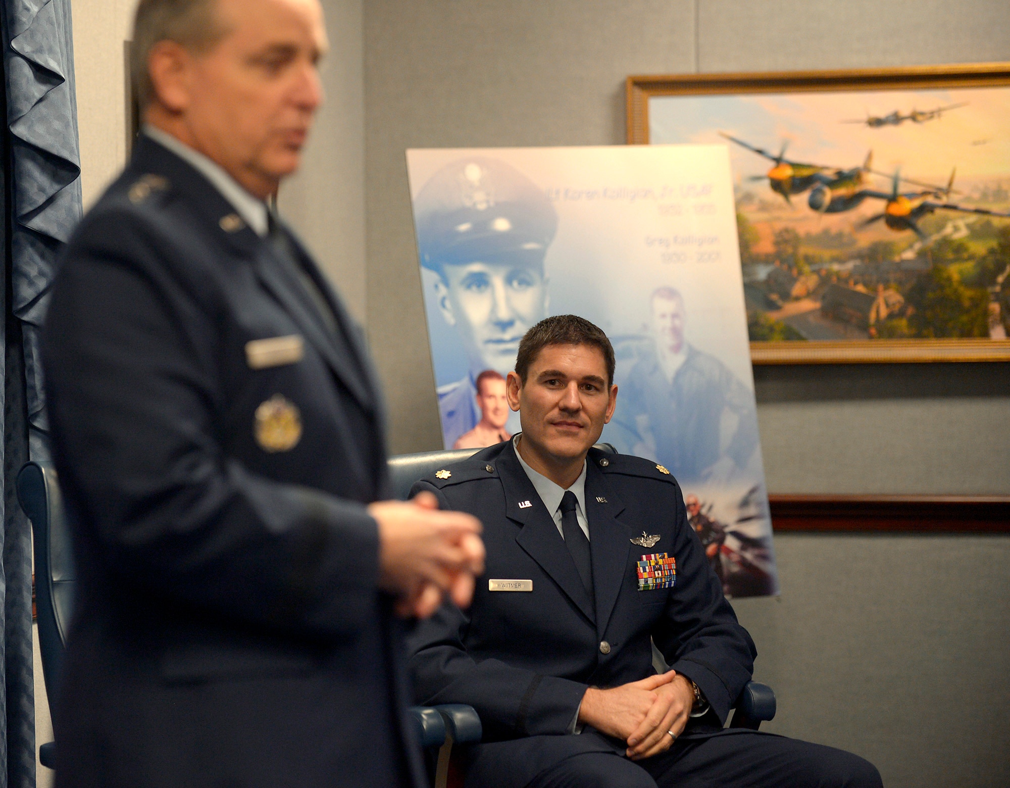 Maj. Douglas Witmer is honored during a ceremony hosted by Air Force Chief of Staff Gen. Mark A. Welsh III in the Pentagon, Nov. 14, 2013. Witmer is this year's recipient of the Koren Kolligian Jr. trophy for outstanding Airmanship. Several members of the Kolligian family were present during the ceremony. (U.S. Air Force photo/Andy Morataya)
