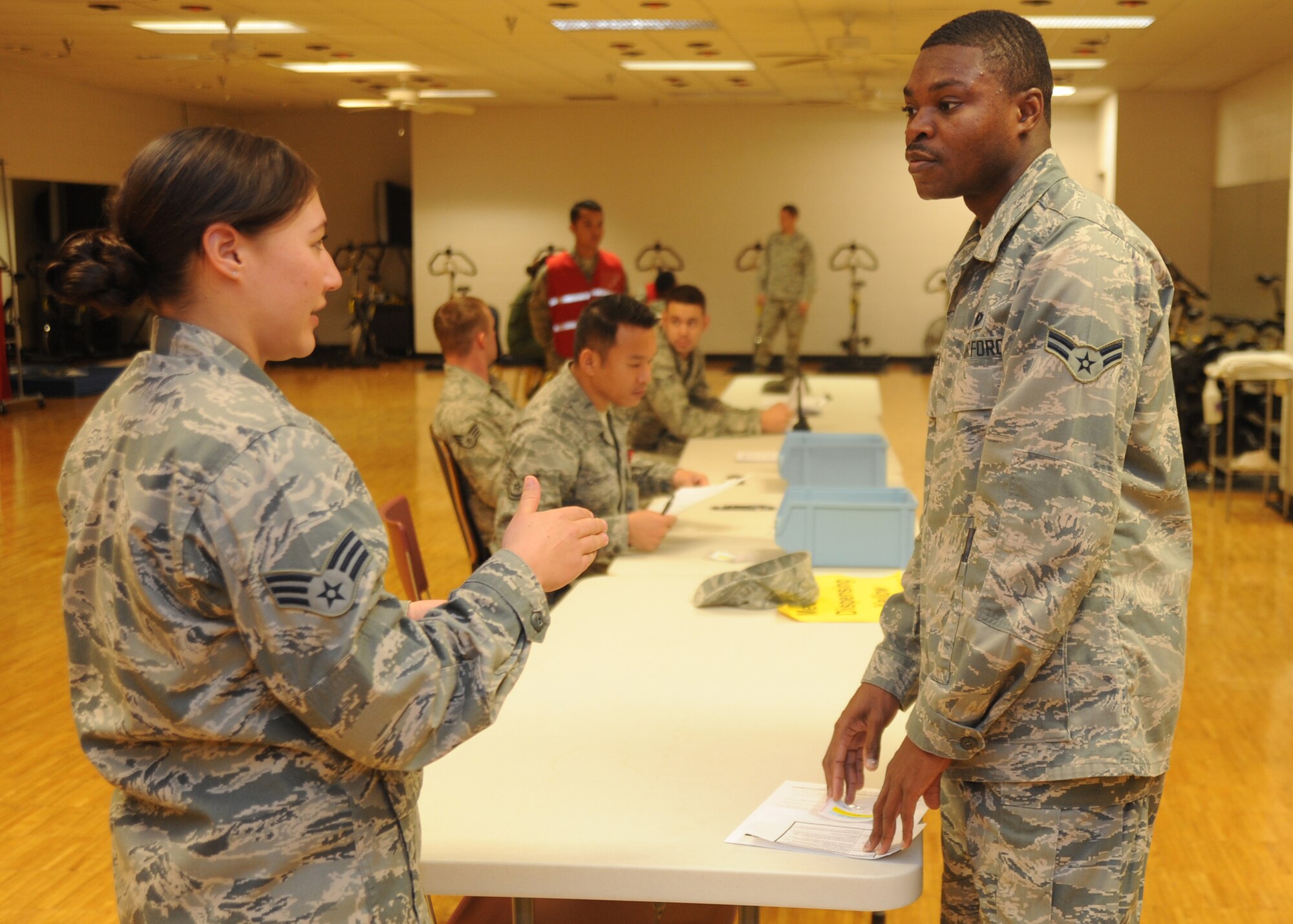 Airman 1st Class Joshua Alormenu, 22nd Logistic Readiness Squadron customer service liaison, goes through a point of distribution during a major accident readiness exercise Nov. 14, 2013, at McConnell Air Force Base, Kan. The exercise scenario included a simulated anthrax outbreak. MAREs are conducted to test McConnell personnel’s response. (U.S. Air Force photo/Senior Airman Maurice A. Hodges)