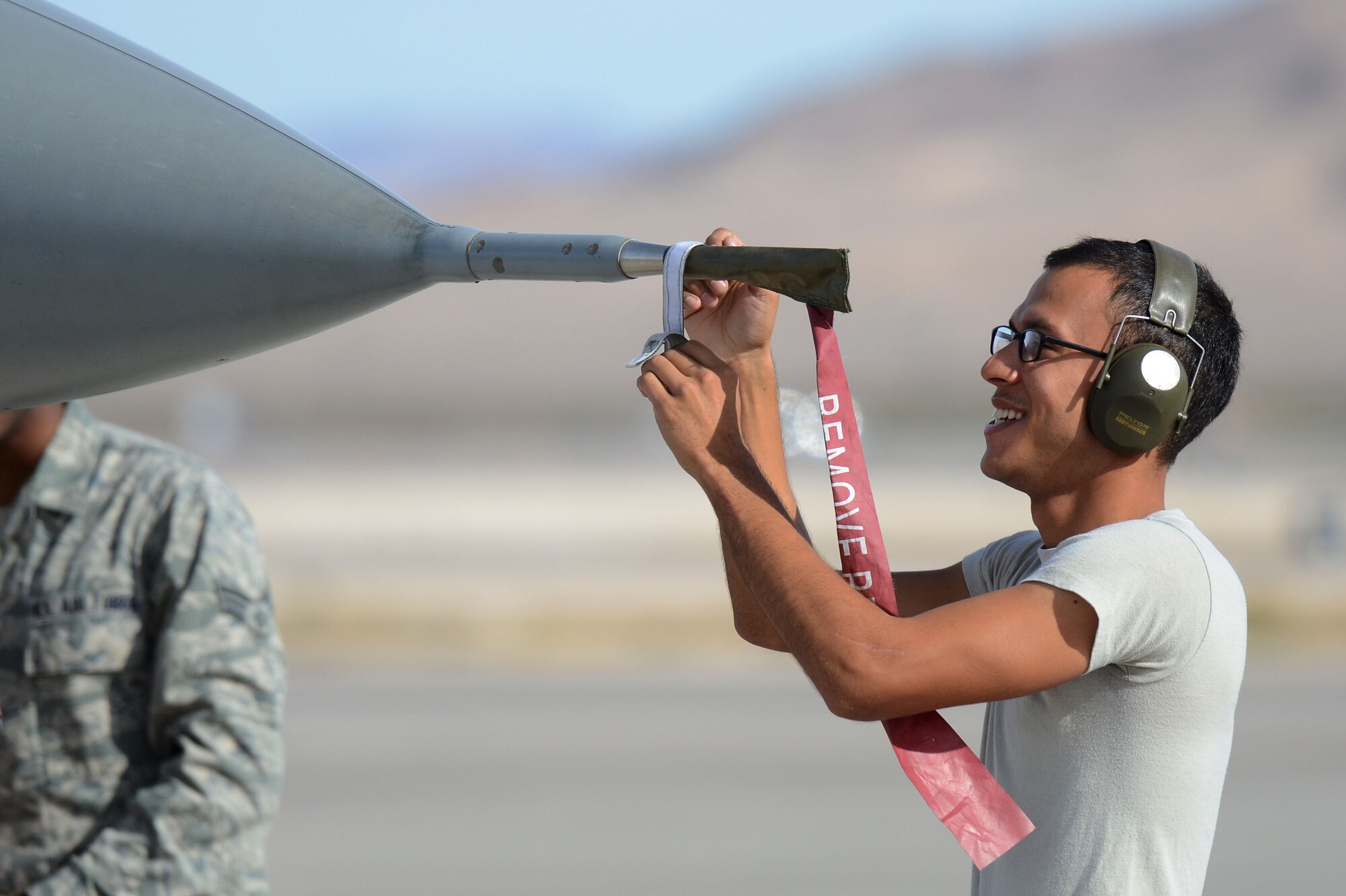 U.S. Air Force Airman 1st Class Jose Soler, a crew chief with the 169th Aircraft Maintenance Squadron at McEntire Joint National Guard Base, South Carolina Air National Guard, conducts post-flight checks on an F-16 Fighting Falcon fighter jet at Nellis Air Force Base, Nev., after it was landed from flying a training mission, Nov. 7, 2013. Members of the 169th Fighter Wing are at Nellis to train for an upcoming Aerospace Expeditionary Force deployment and to support Green Flag-West, a joint close-air support training mission for forces preparing to support combat operations.
(U.S. Air National Guard photo by Tech. Sgt. Caycee Watson/Released)