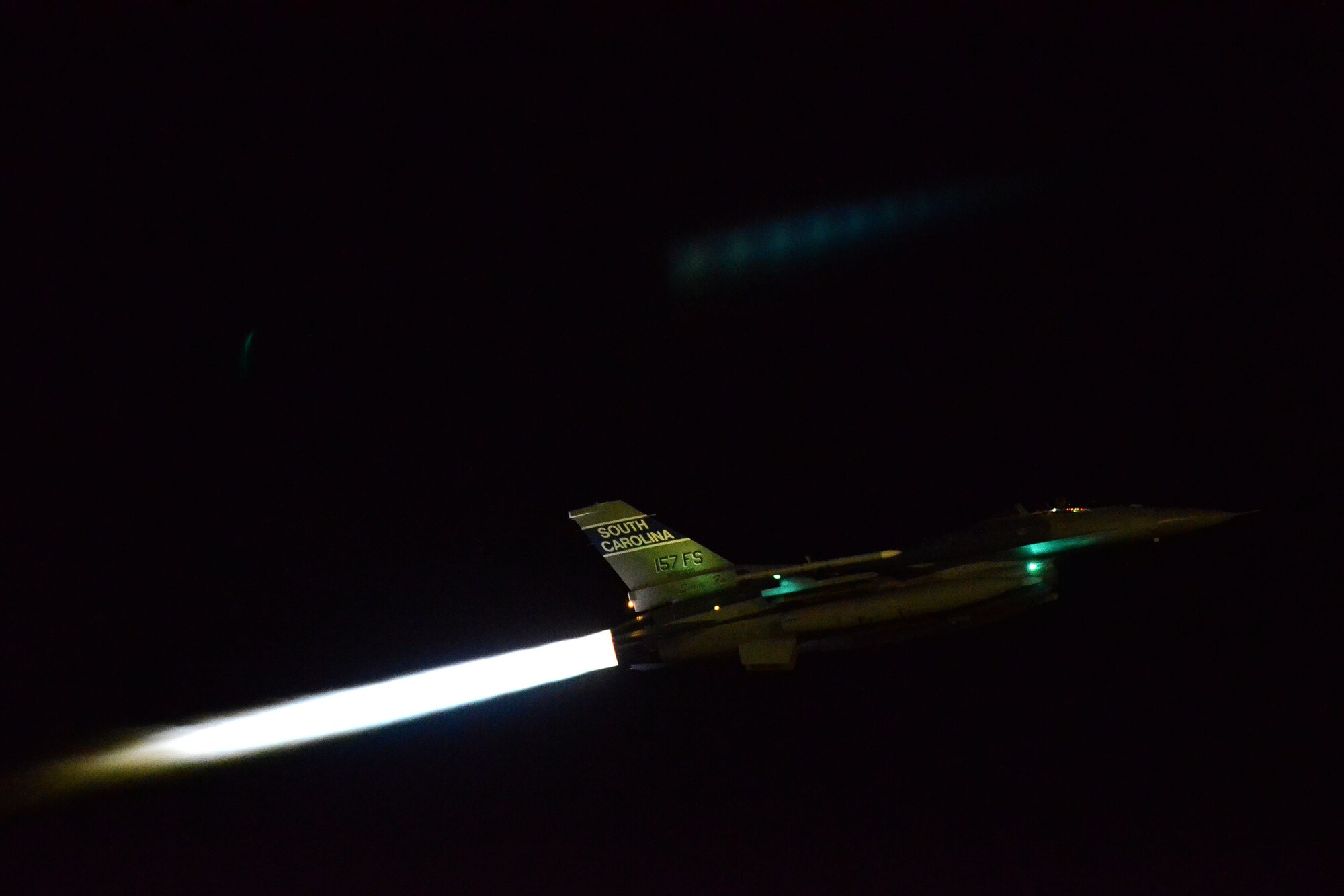 A U.S. Air Force F-16 Fighting Falcon fighter jet from the 157th Fighter Squadron at McEntire Joint National Guard Base, South Carolina Air National Guard, takes off for a night flying mission from Nellis Air Force Base, Nev., Nov. 6, 2013. Members of the 169th Fighter Wing are at Nellis to train for an upcoming Aerospace Expeditionary Force deployment and to support Green Flag-West, a joint close-air support training mission for forces preparing to support combat operations.
(U.S. Air National Guard photo by Tech. Sgt. Caycee Watson/Released)