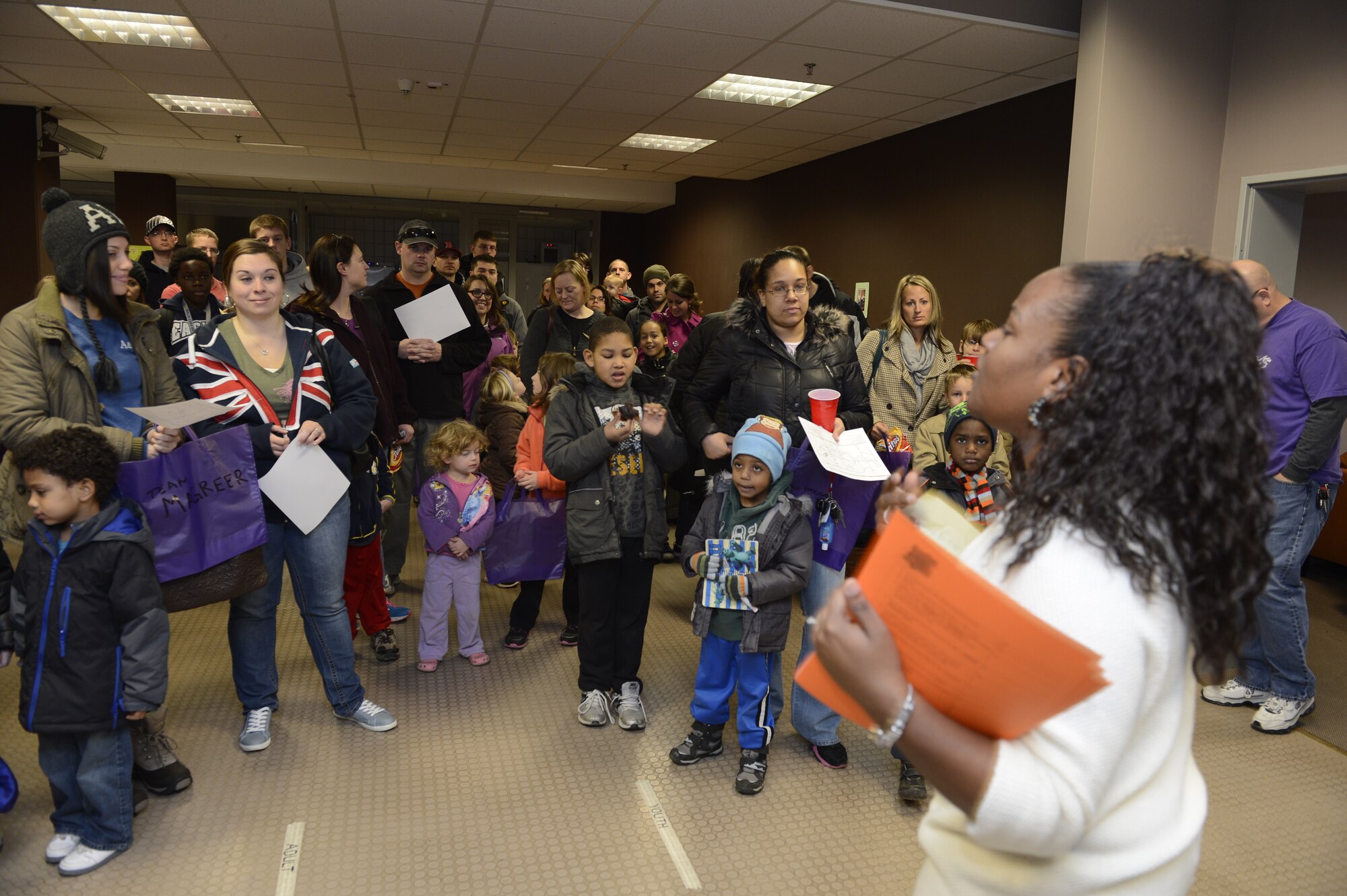 SPANGDAHLEM AIR BASE, Germany—Allisa Shepard, 52nd Force Support Squadron Airman & Family Readiness Center community readiness specialist from New York City, explains the rules of the A&FRC scavenger hunt Nov. 16, 2013. The scavenger hunt coincided with the Month of the Military Family. (U.S. Air Force photo by Staff Sgt. Christopher Ruano/Released)