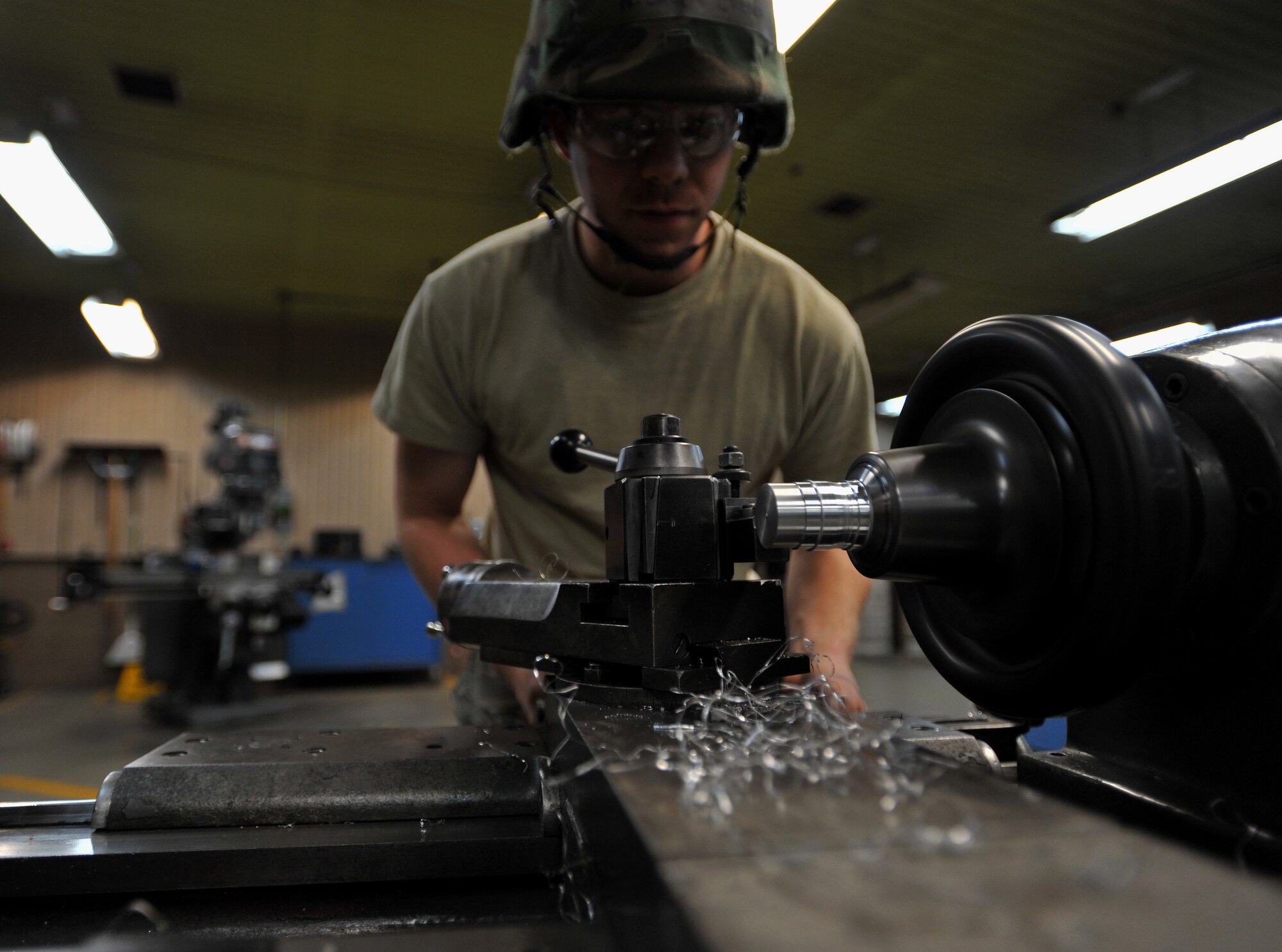 Senior Airman Nicholas Creech, 51st Maintenance Squadron aircraft metals technology journeyman, faces a piece of aluminum during Operational Readiness Exercise Beverly Bulldog 14-01 at Osan Air Base, Republic of Korea, Nov. 18, 2013. Metals technicians combine on-aircraft work and in-shop fabrication. (U.S. Air Force photo/Senior Airman Siuta B. Ika)