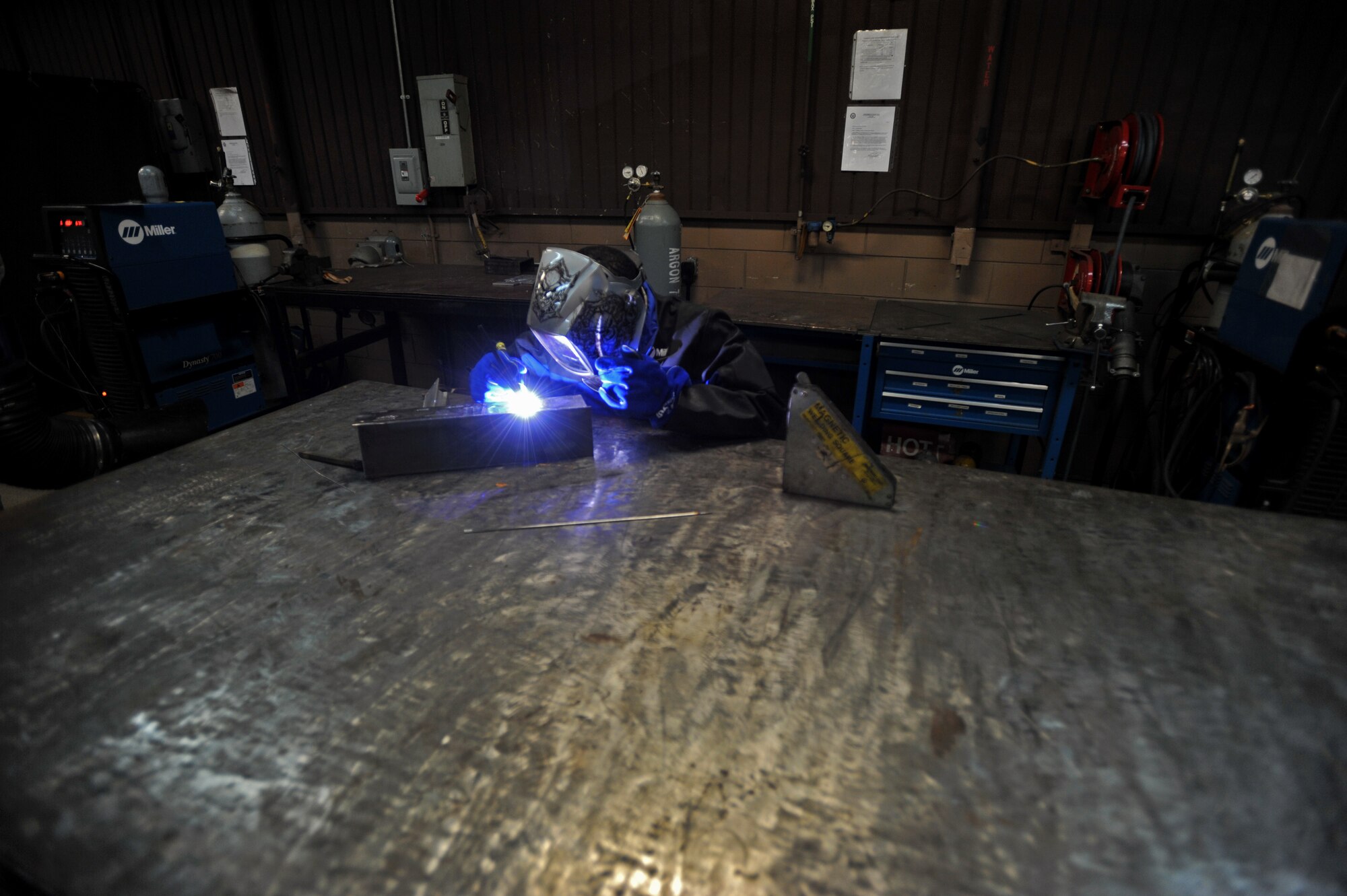 Senior Airman Mahrod Reese, 51st Maintenance Squadron aircraft metals technology journeyman, welds a piece of metal during Operational Readiness Exercise Beverly Bulldog 14-01 at Osan Air Base, Republic of Korea, Nov. 18, 2013. Working on everything from aircraft to underground equipment, the metals technology shop accomplishes a variety of metal work for units across the base. (U.S. Air Force photo/Senior Airman Siuta B. Ika)