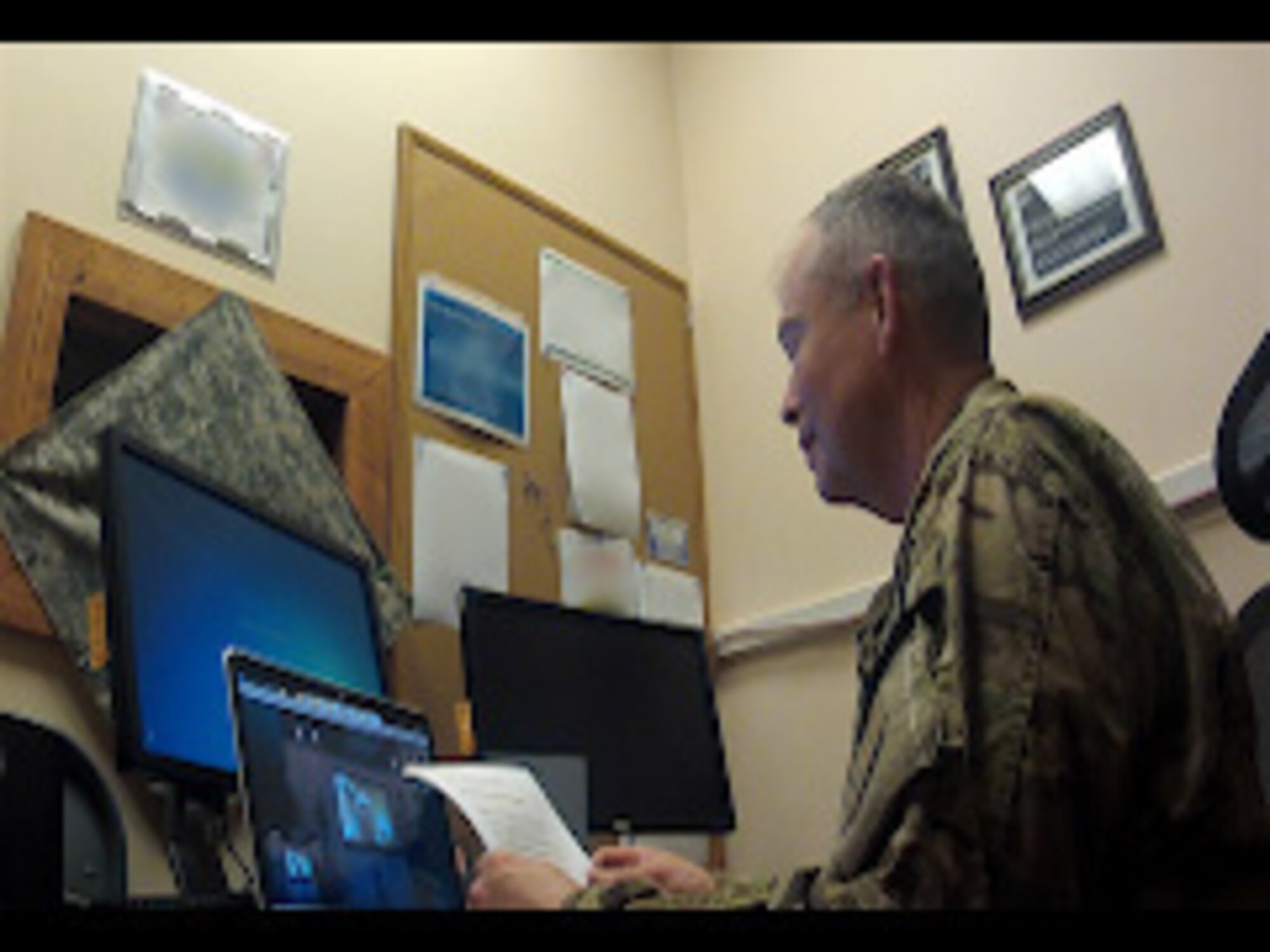Chaplain (Lt. Col.) David Mansberger, 455th Air Expeditionary Wing head chaplain, officiated Matthew and Kellie Raferty’s wedding via Skype while being deployed to Bagram Airfield, Afghanistan, Nov. 17, 2013. (U.S. Air Force photo)
