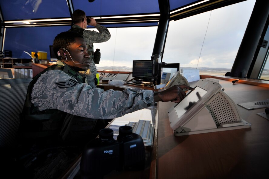 Staff Sgt. Anthtae Taggart, 51st Operations Support Squadron air traffic controller, talks to a pilot to help navigate him toward the flight line during Operational Readiness Exercise Beverly Bulldog 14-01 at Osan Air Base, Republic of Korea, Nov. 18, 2013. Airmen will perform 24-hour operations during the week-long exercise. (U.S. Air Force photo/Staff Sgt. Emerson Nuñez)
