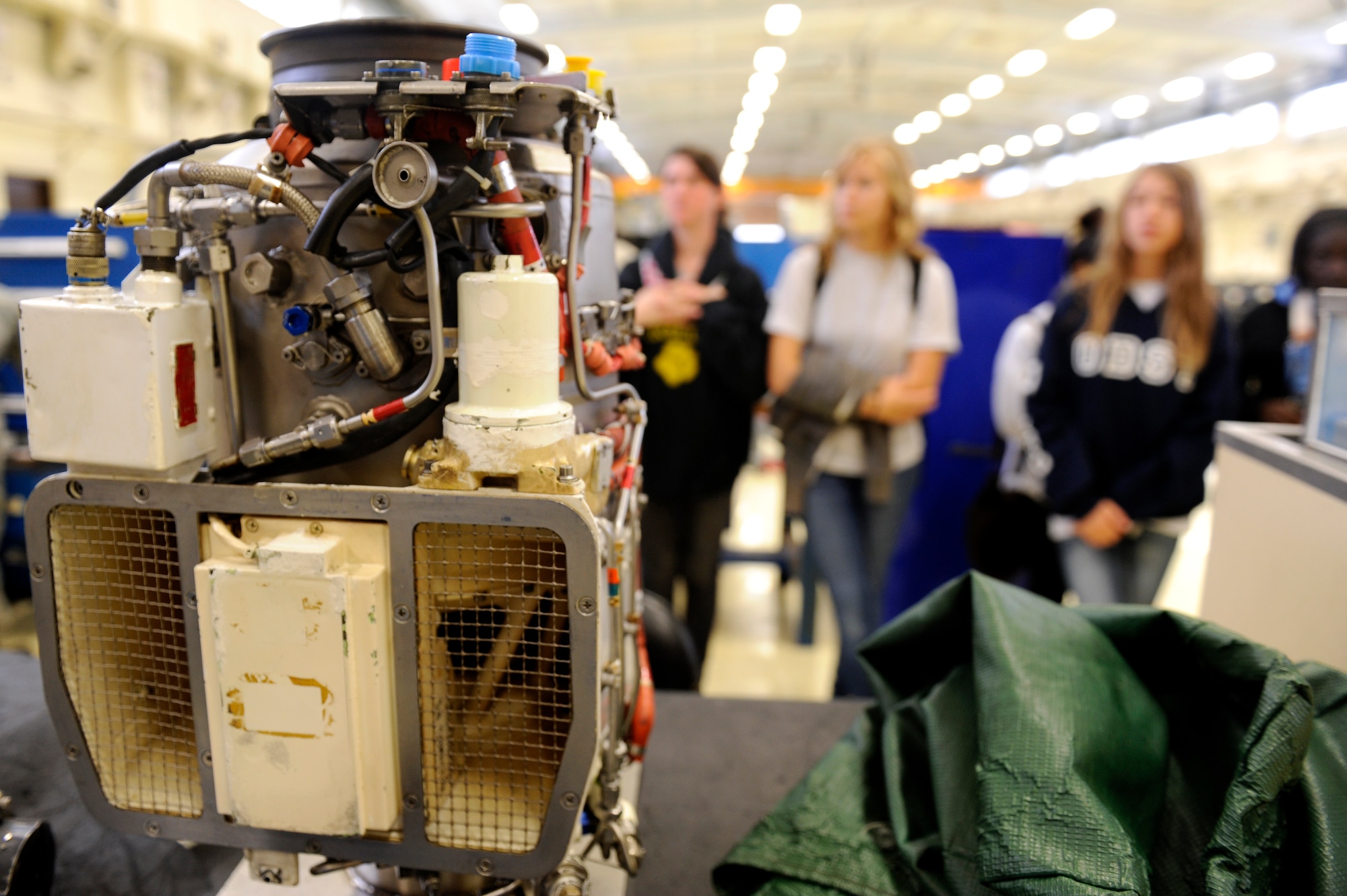Kadena High School Air Force Junior Reserve Officer Training Course students look at a jet fuel starter for an F-15 Eagle engine start system during a tour of the 18th Component Maintenance Squadron Propulsion Flight on Kadena Air Base, Japan, Nov. 14, 2013. During the tour of the 18th CMS propulsion shop, Kadena HS JROTC students, who aspire to be future engineers, were taught about different components and functions of F-15 Eagle and A-10 Thunderbolt II aircraft engines. (U.S. Air Force photo by Senior Airman Maeson L. Elleman)