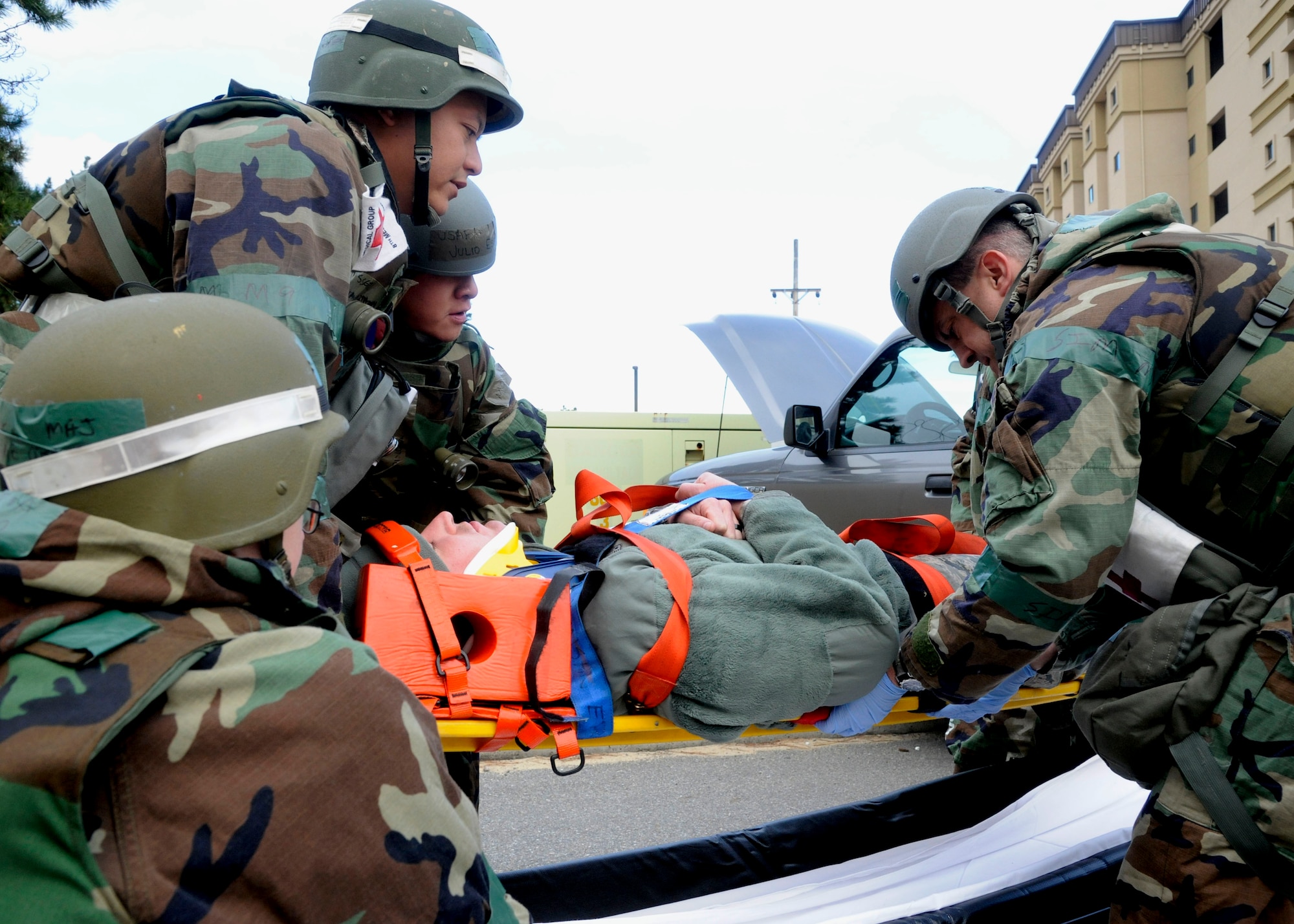 Airmen from the 8th Medical Group recover a simulated crash victim during Exercise Beverly Bulldog 14-1 at Kunsan Air Base, Republic of Korea, Nov. 18, 2013. Exercise Beverly Bulldog 14-1 demonstrates and enhances the readiness of the 7th Air Force to defend and sustain the capabilities which strengthen the ROK-U.S. Alliance. (U.S. Air Force photo by Staff Sgt. Jessica Haas/Released)