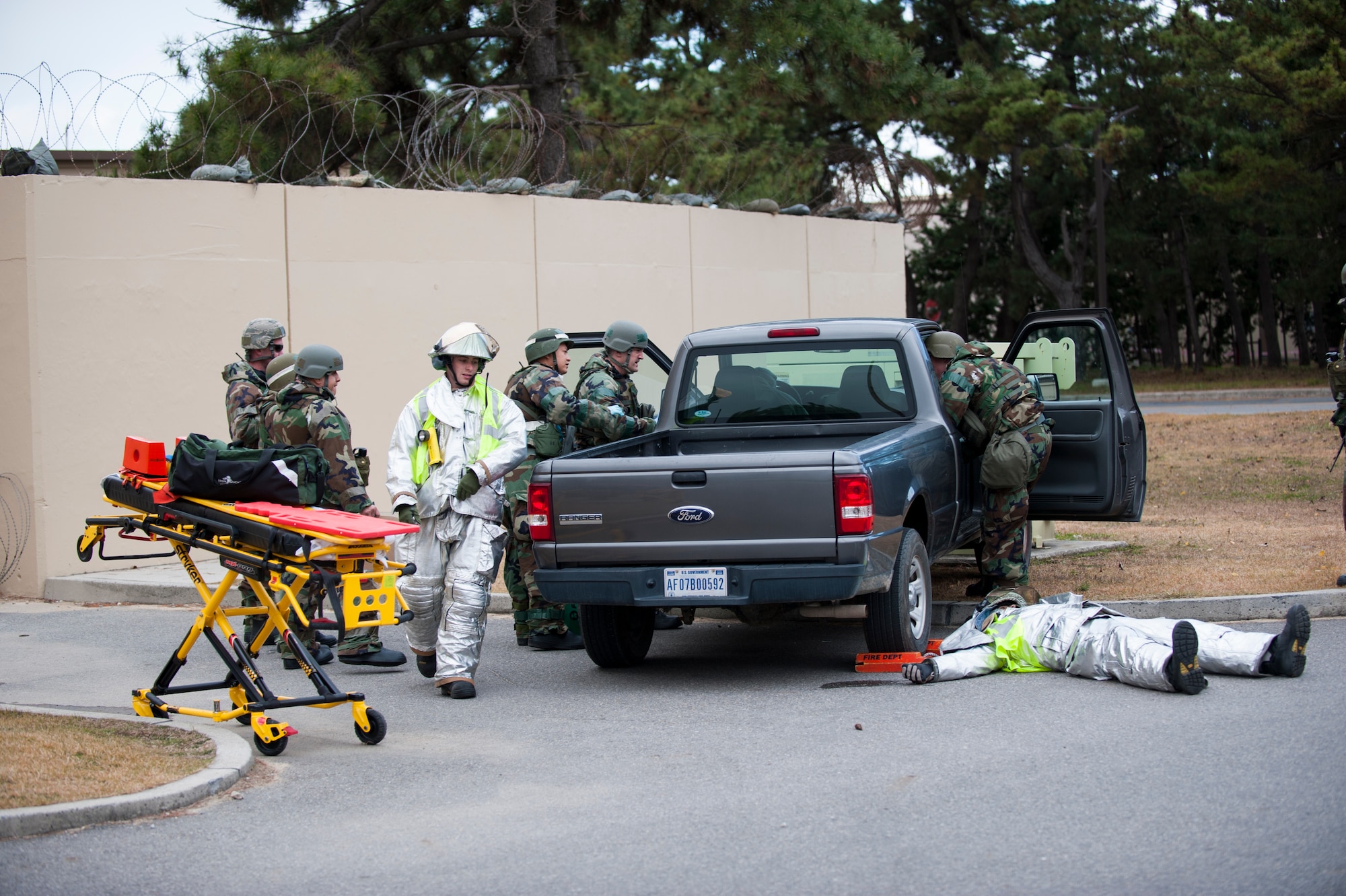 Airmen from the 8th Civil Engineer Squadron fire department and 8th Medical Group respond to a simulated crash during Exercise Beverly Bulldog 14-1 at Kunsan Air Base, Republic of Korea, Nov. 18, 2013. Exercise Beverly Bulldog 14-1 demonstrates and enhances the readiness of the 7th Air Force to defend and sustain the capabilities which strengthen the ROK-U.S. Alliance. (U.S. Air Force photo by Senior Airman Clayton Lenhardt/Released)