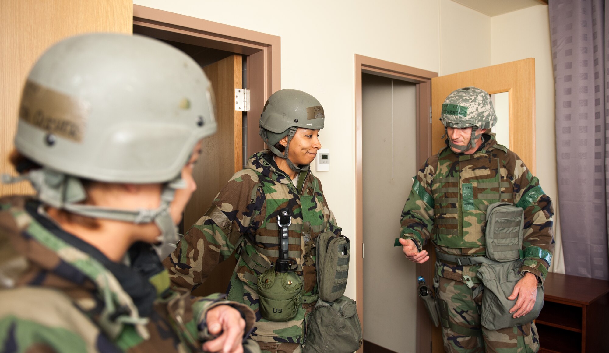 Col. S. Clinton Hinote, 8th Fighter Wing commander, speaks to 8th Force Support Squadron Airmen about the bed-down procedure during Exercise Beverly Bulldog 14-1 at Kunsan Air Base, Republic of Korea, Nov. 18, 2013. The 8th Fighter Wing demonstrates its ability to room multiple Airmen in its chemical protection system dormitories. Airmen were moved from their non-protected dorms into shared rooms in CPS dormitories. The exercise tested the wartime mission alongside other 7th Air Force units and supporting organizations with an emphasis on the operational and tactical levels of war during the peninsula-wide exercise. (U.S. Air Force photo by Senior Airman Armando A. Schwier-Morales/Released)