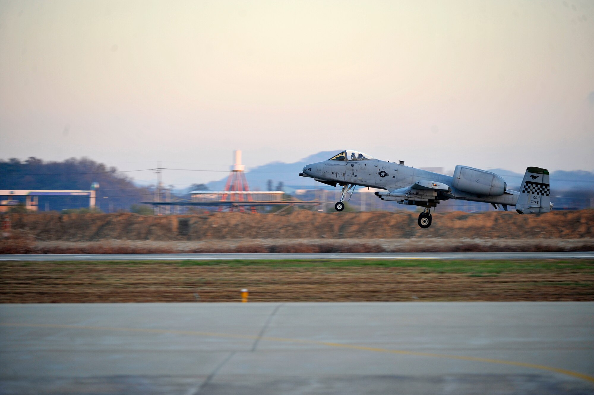 An A-10 Thunderbolt from the 25th Fighter Squadron takes off during the first sortie of Operational Readiness Exercise Beverly Bulldog 14-01 at Osan Air Base, Republic of Korea, Nov. 18, 2013. During the week, Osan Airmen will be tested on their ability to utilize their chemical, biological, radiological and nuclear training, as well as administer self-aid and buddy-care during contingency operations. (U.S. Air Force photo/Staff Sgt. Emerson Nuñez)