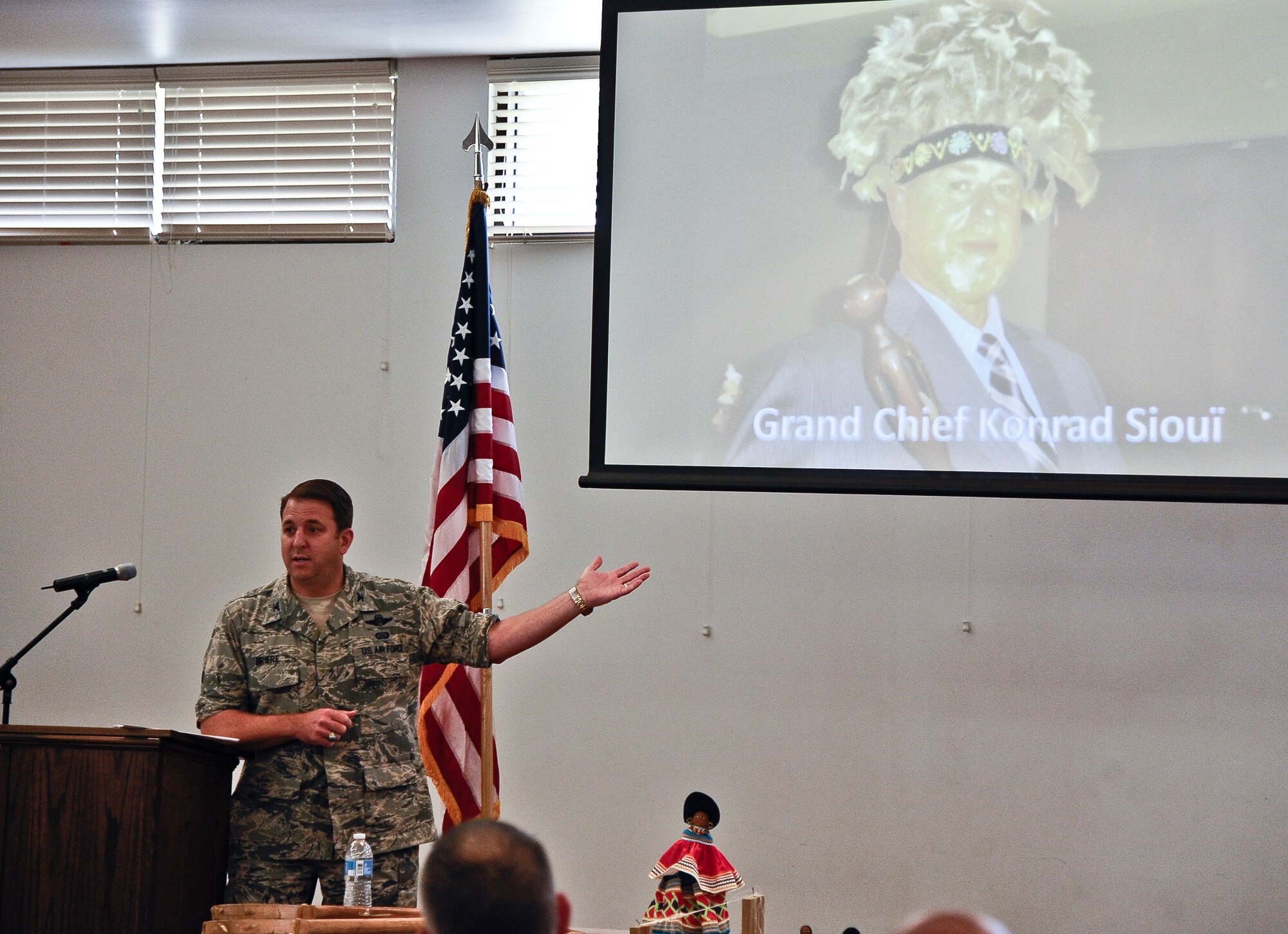 Col. Andre Briere, 6th Air Mobility Wing vice commander and descendent of the Huron-Wendat/Wendake, talks about his tribe's current clan leader, Grand Chief Konrad Sioui, during a National American Indian Heritage Month lunch and learn Nov. 13, 2013, at MacDill Air Force Base, Fla. Briere stated that Native Americans are one of the most stereotyped groups, and oftentimes many do not fit the profiles portrayed on television. (U.S. Air Force photo by Senior Airman Michael Ellis/Released)   
