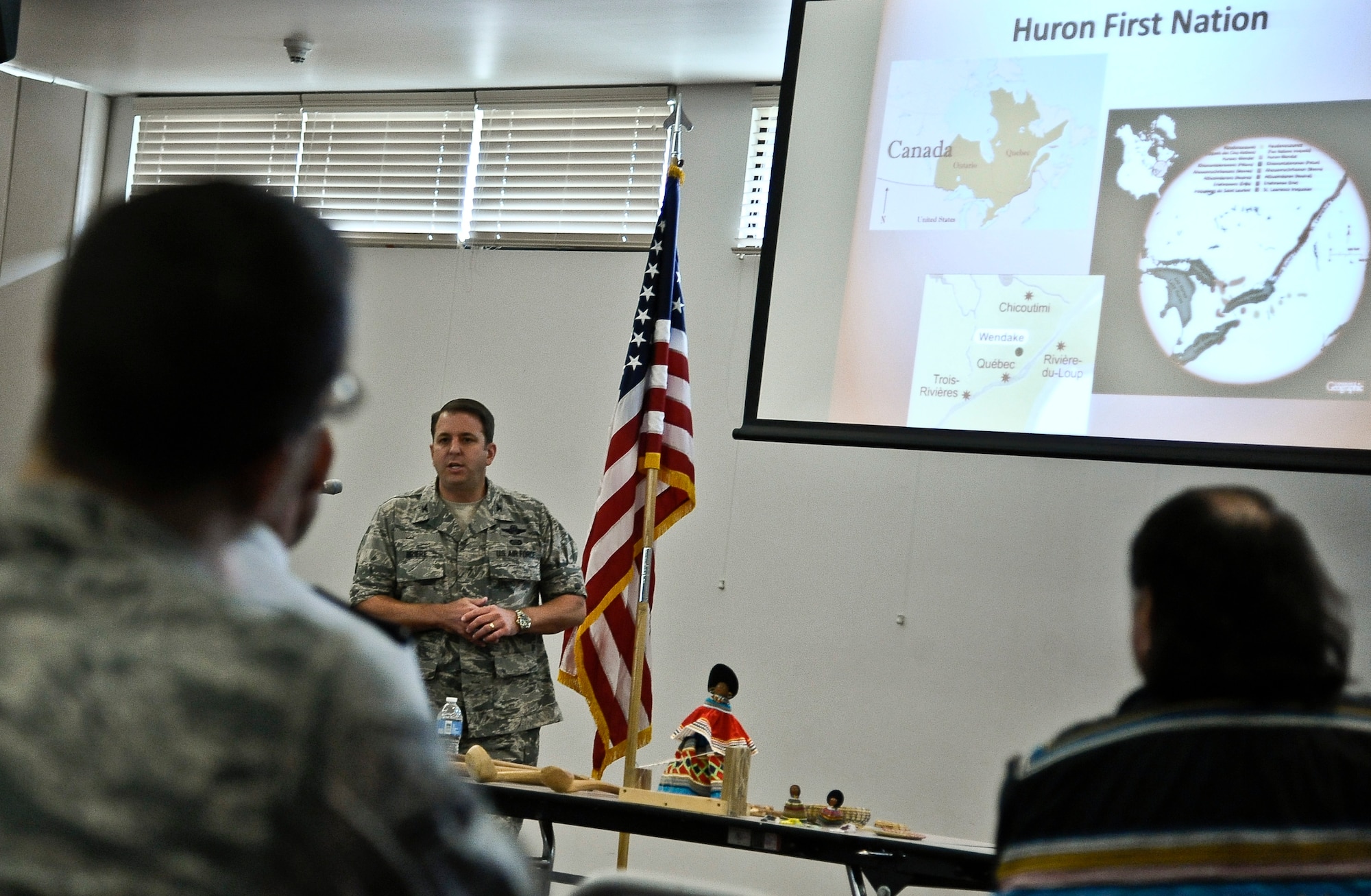 Col. Andre Briere, 6th Air Mobility Wing vice commander and descendent of the Huron-Wendat/Wendake, speaks about his hertiage during a National American Indian Heritage Month lunch and learn Nov. 13, 2013, at MacDill Air Force Base, Fla. Briere mentioned that the indigenous groups are not called Native Americans in Canada; they’re called 'first nations.' (U.S. Air Force photo by Senior Airman Michael Ellis/Released)   
