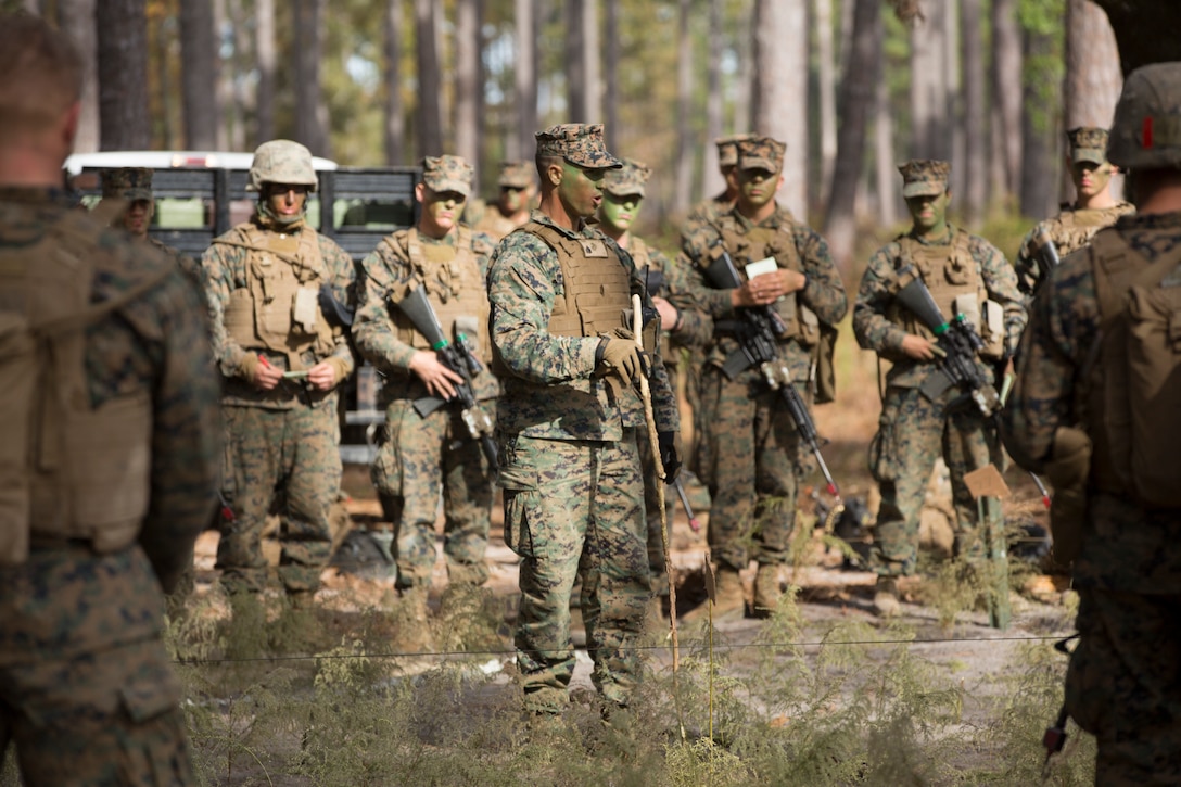 Marine Corps Sgt. David Rogers delivers combat order to students before ...