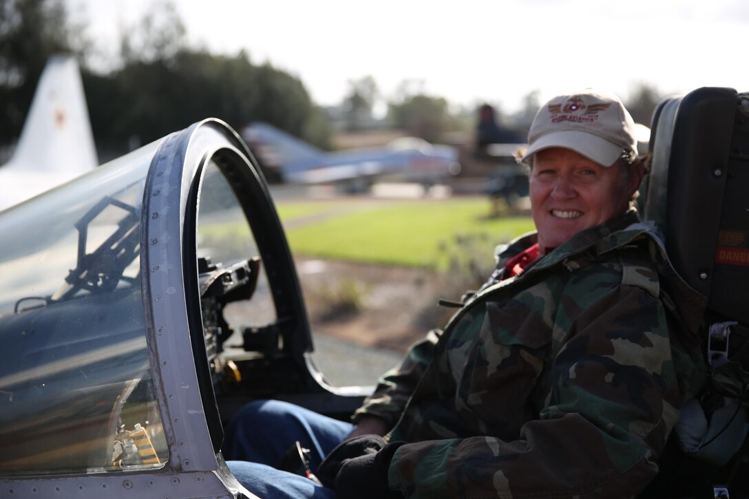 Ron Lewis, the foundation historian at The Flying Leatherneck Aviation museum, sits in the cockpit of an F/A-18 Hornet aboard Marine Corps Air Station Miramar, Calif., Nov. 17. Lewis assisted visitors to the museum by helping them into the cockpit of the F/A-18 on display and describing the history of the aircraft. 