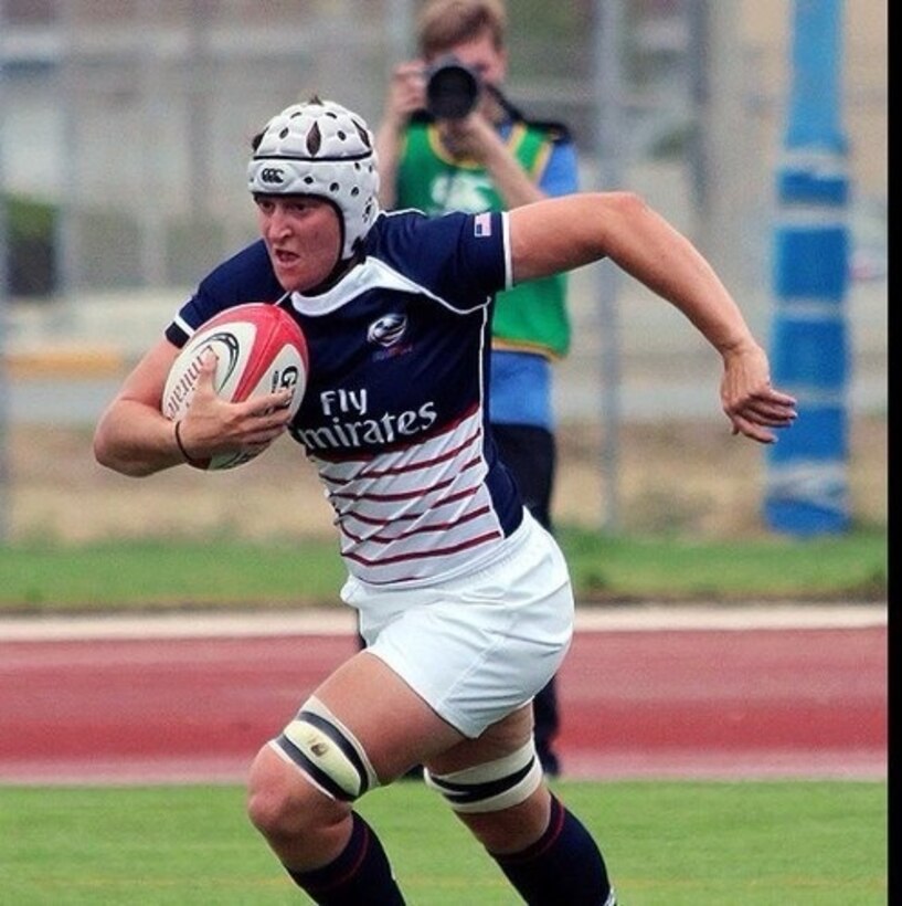 Rugby player ,Capt. Shaina M. Turley, a CH-46E pilot for Marine Medium Helicopter Training Squadron 164, sprints down the field during a rugby match against France. Turley was named the female 2012 Marine Corps Athlete of the Year. The Olympic hopeful is from Fox Lake, Ill.
