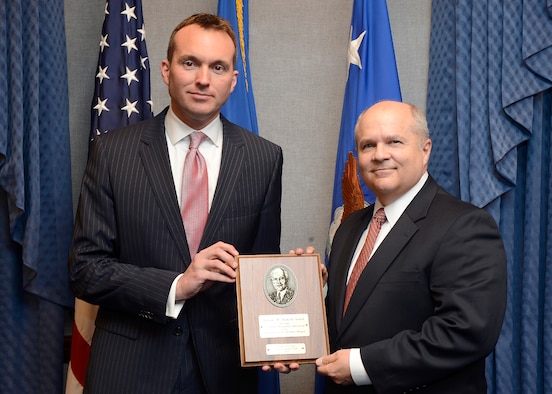 Acting Secretary of the Air Force Eric Fanning (left) presents retired Maj. Gen Charles Lyon the Zuckert Management award during a Pentagon ceremony, Nov. 18, 2013.  The Zuckert Management Award is named after the seventh secretary of the Air Force and is presented annually to recognize outstanding top-level Air Force managers.  (U.S. Air Force photo/Scott M. Ash)